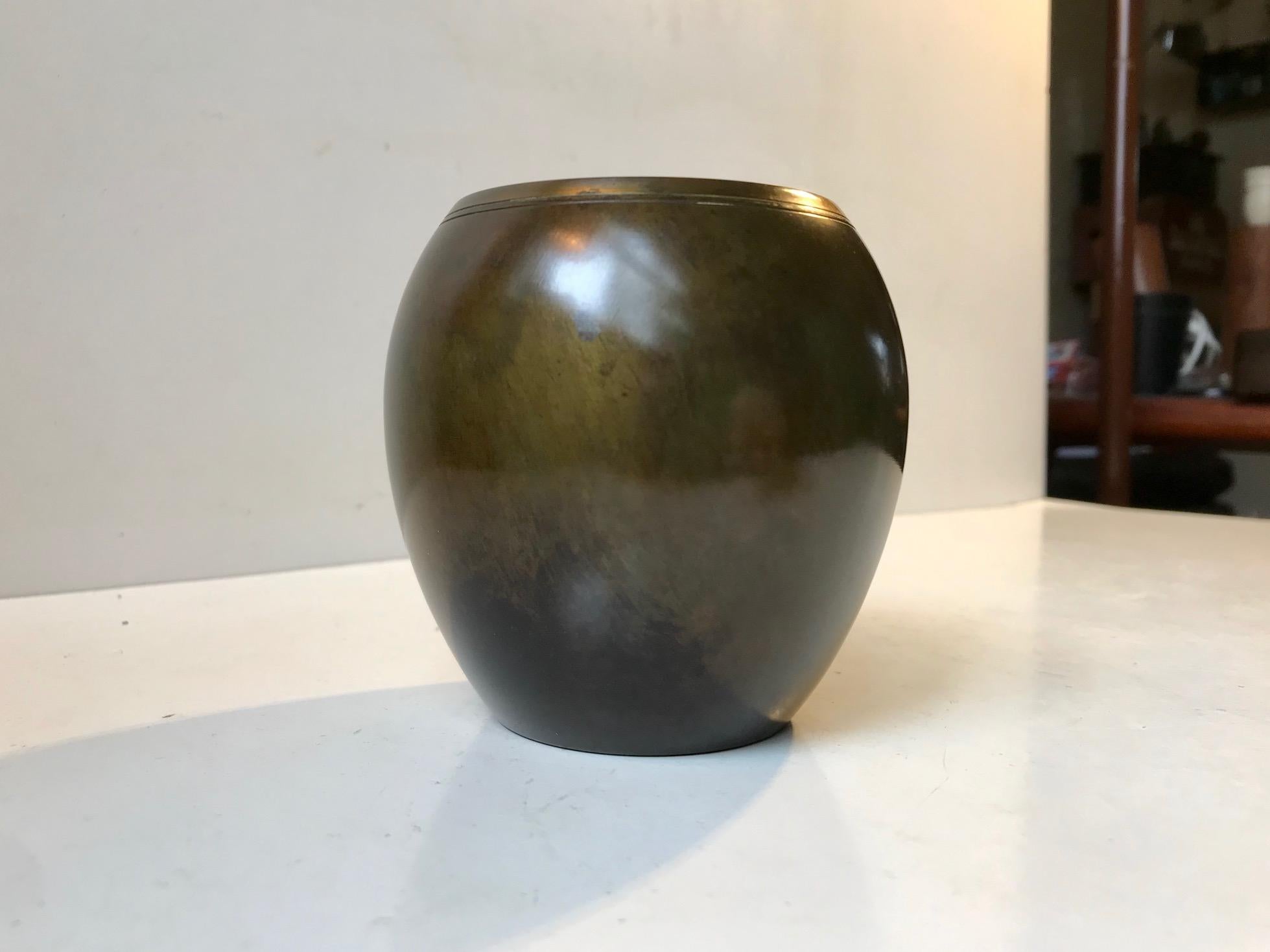 Patinated vase in light bronze designed by Just Andersen and manufactured in the early 1930s. Fully signed and numbered to its base.