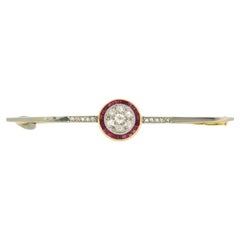 ART DECO brooch set with ruby and diamonds up to 0.50ct 18k bicolour gold