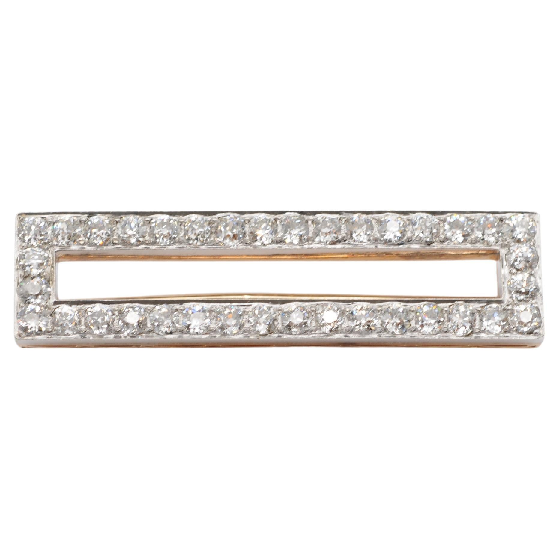 Prepare to be enchanted by the timeless elegance of this breathtaking 18k rose and white gold brooch. Adorned with a total of 36 old-cut diamonds, each shimmering with a weight ranging from approximately 0.10ct to 0.13ct and boasting a clarity of