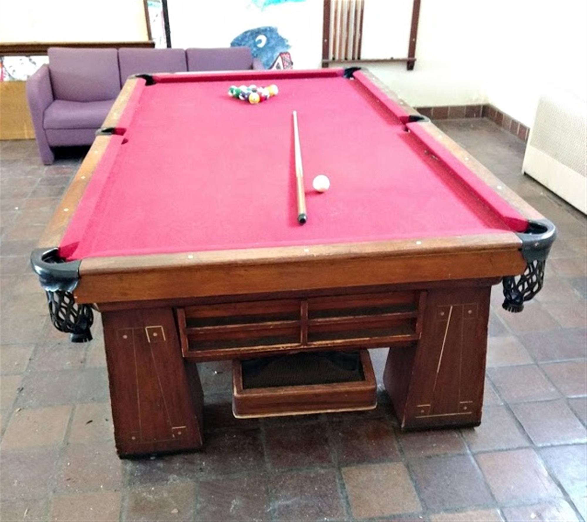 The Brunswick Metropolitan style billiard table was manufactured from 1938-1940. Slate bed below the red felt. American made by the famous Brunswick Billiard Company. In fair condition and in need of restoration. Disassembled right now as too heavy