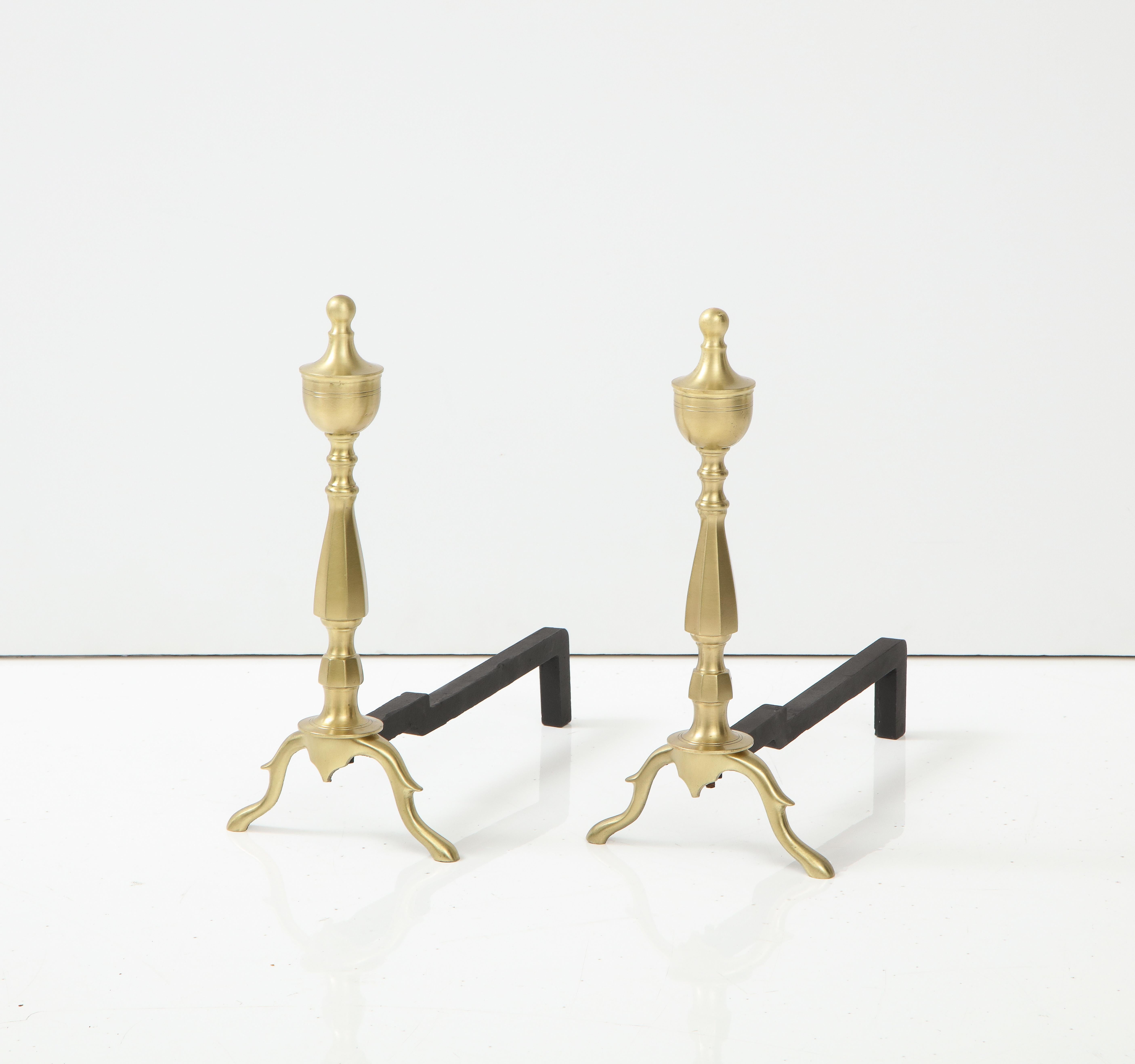 Art Deco satin brass andirons with traditional details on blackened iron backs. Mint Restored.