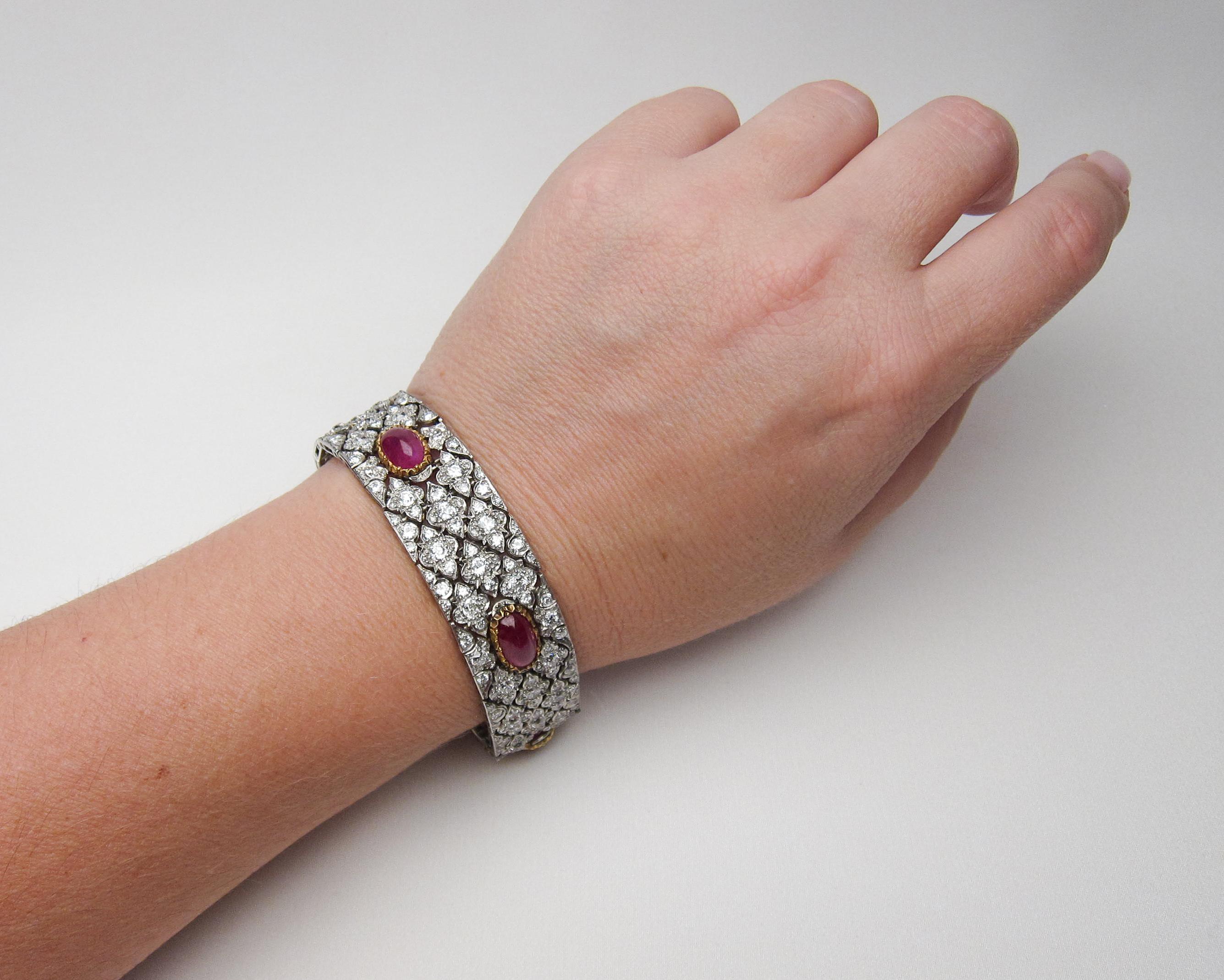 Circa 1930. This splendid fancy link platinum Buccellati bracelet features five oval natural ruby (untreated) cabochons weighing 16.6 carats and set into textured 18KT gold bezels. These rubies are surrounded by 290 prong-set old European and round