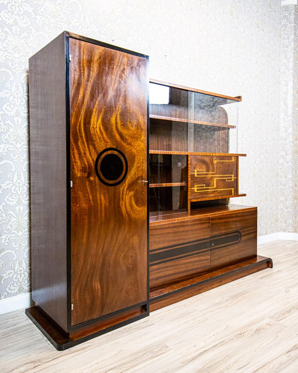 Art Deco Buffet From the 1930s by J. Jojko in Pine Veneer

We present you a buffet from the 1930s made by the Jan Jojko Artistic Furniture Manufactory in Rybnik.
This piece of furniture is of a highly modern form as for its times.
It is composed of