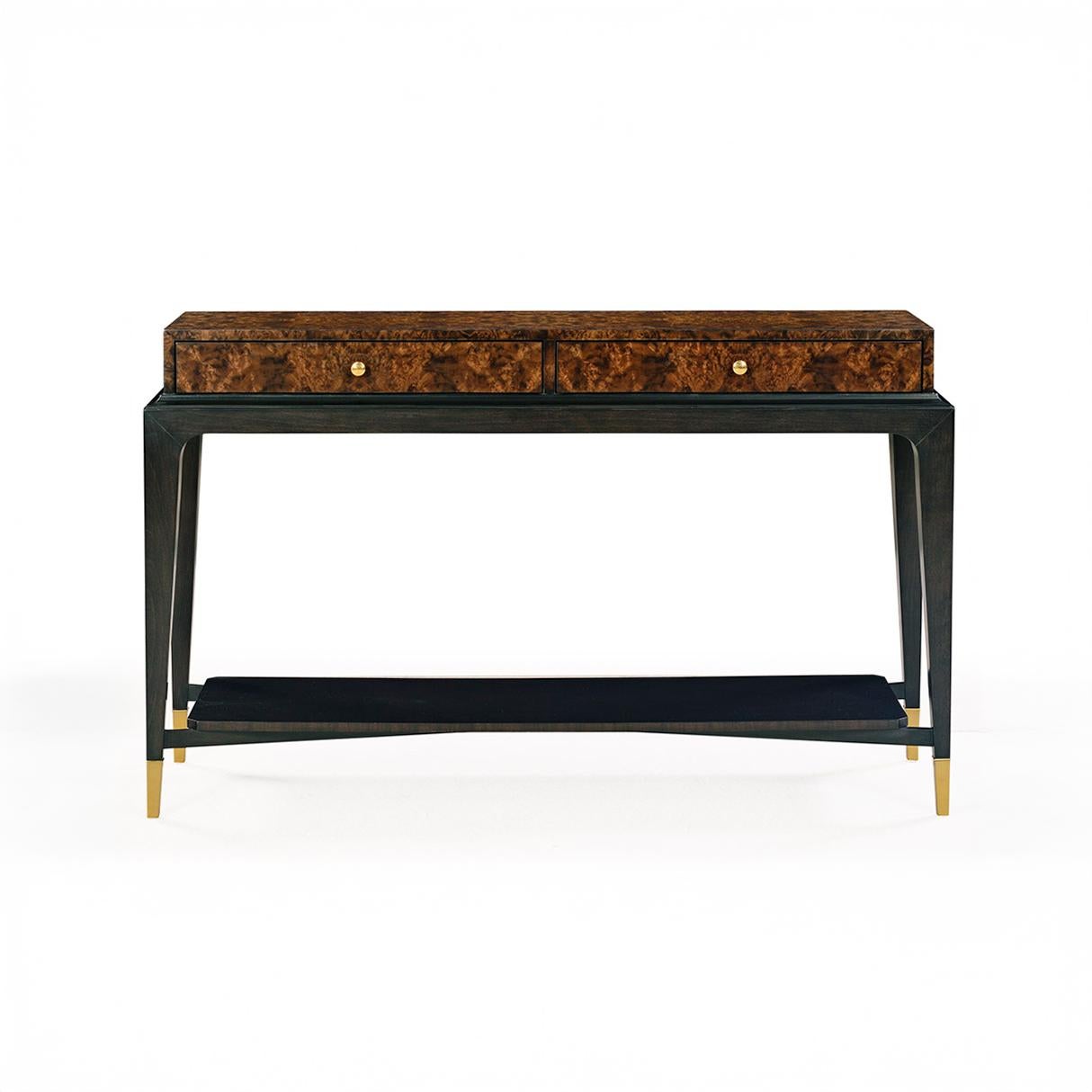 The console blends bold geometry with timeless sophistication. Its slim profile is elevated by a stunning walnut burl veneer top in a natural finish, offering rich depth and organic pattern. Two sleek drawers provide discreet storage, seamlessly