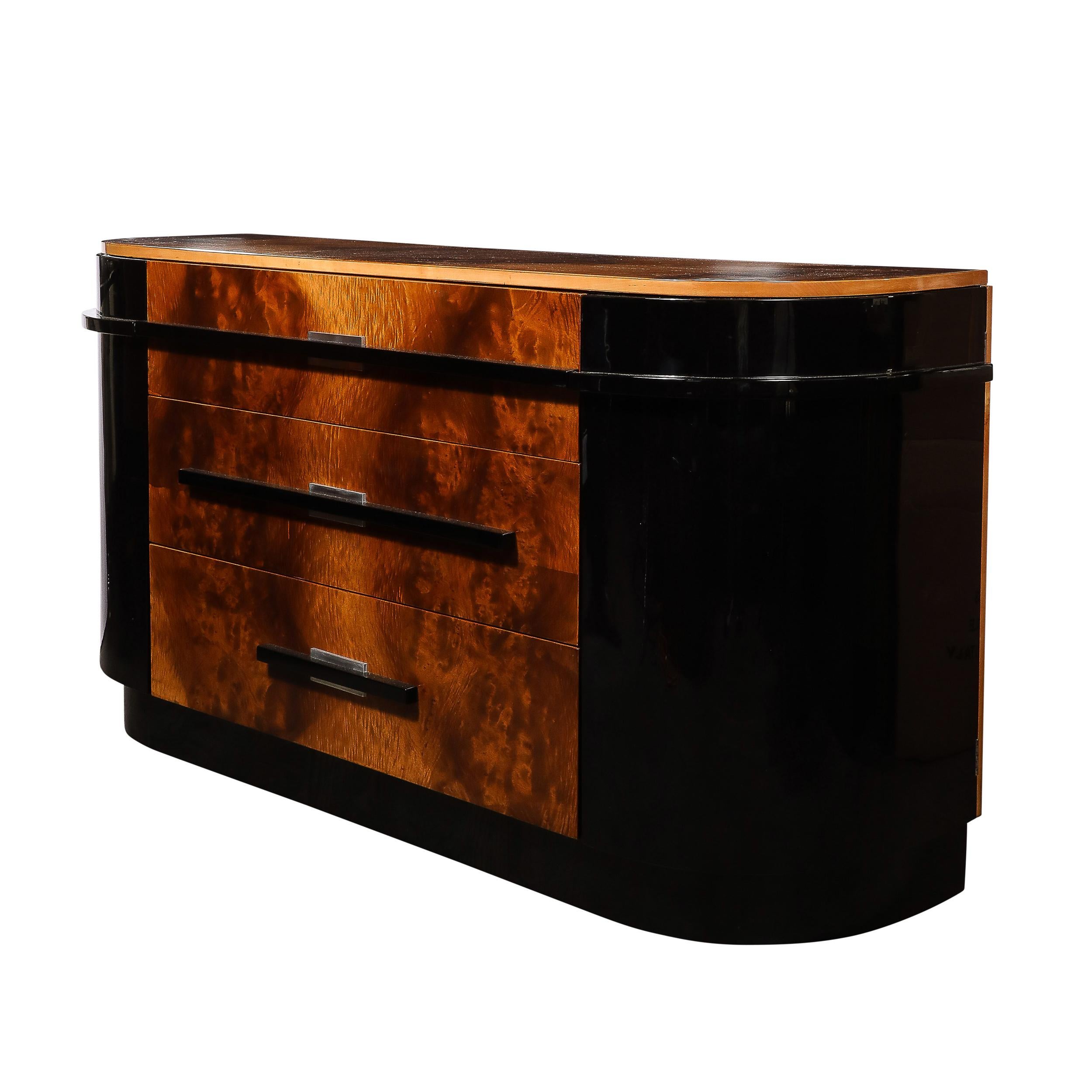 This highly unique and stunning Art Deco Streamlined Machine Age Sideboard in Burled Walnut & Black Lacquer w/ Aluminum Pulls is by the esteemed designer Donald Deskey for the Hastings Company and originates from the United States, Circa 1935.