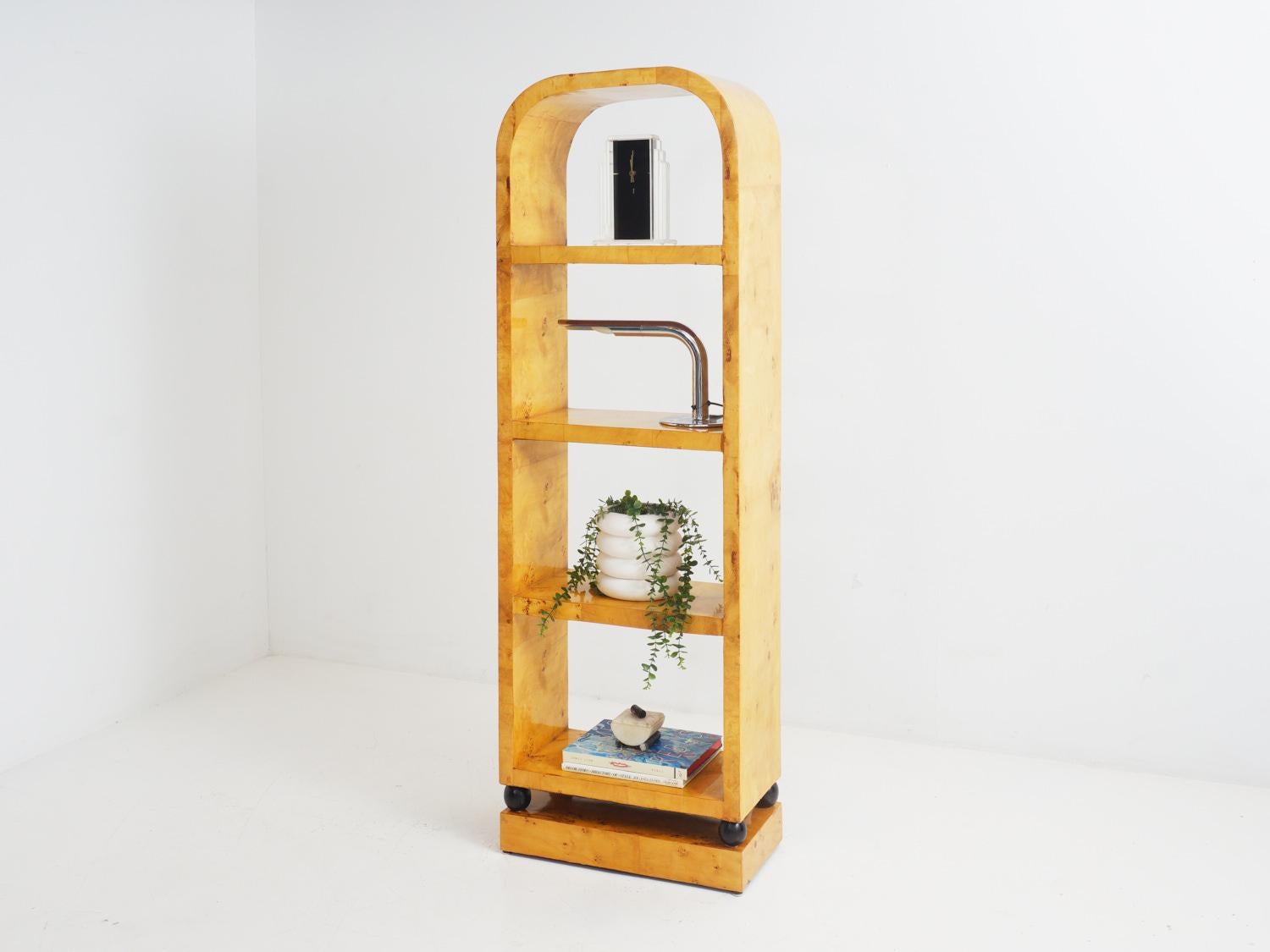 Picture this: an Art Deco dream brought to life in the form of a burlwood open etagere! Graceful curves and lustrous wood blend seamlessly to create a show-stopping display. Flaunt your cherished mementos while channeling your inner roaring 1920's