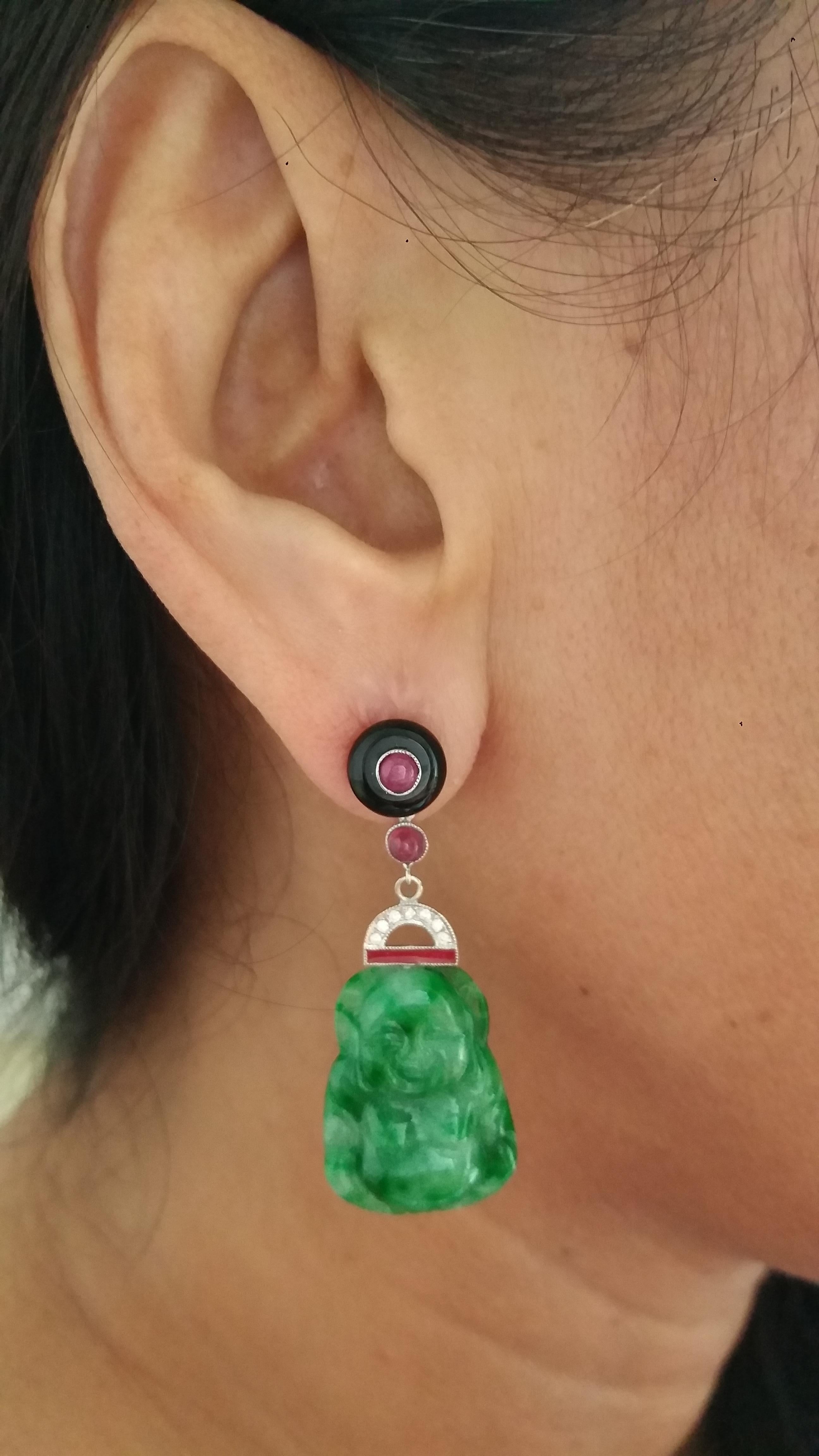 2 round Black Onix buttons tops with small round rubies cabochons in the center,central parts in white gold,small round rubies,14 round full cut diamonds,red enamel,and 2 Burma Jade Buddhas
Length 47 mm
Width 16 mm
Weight 9 grams
In 1978 our