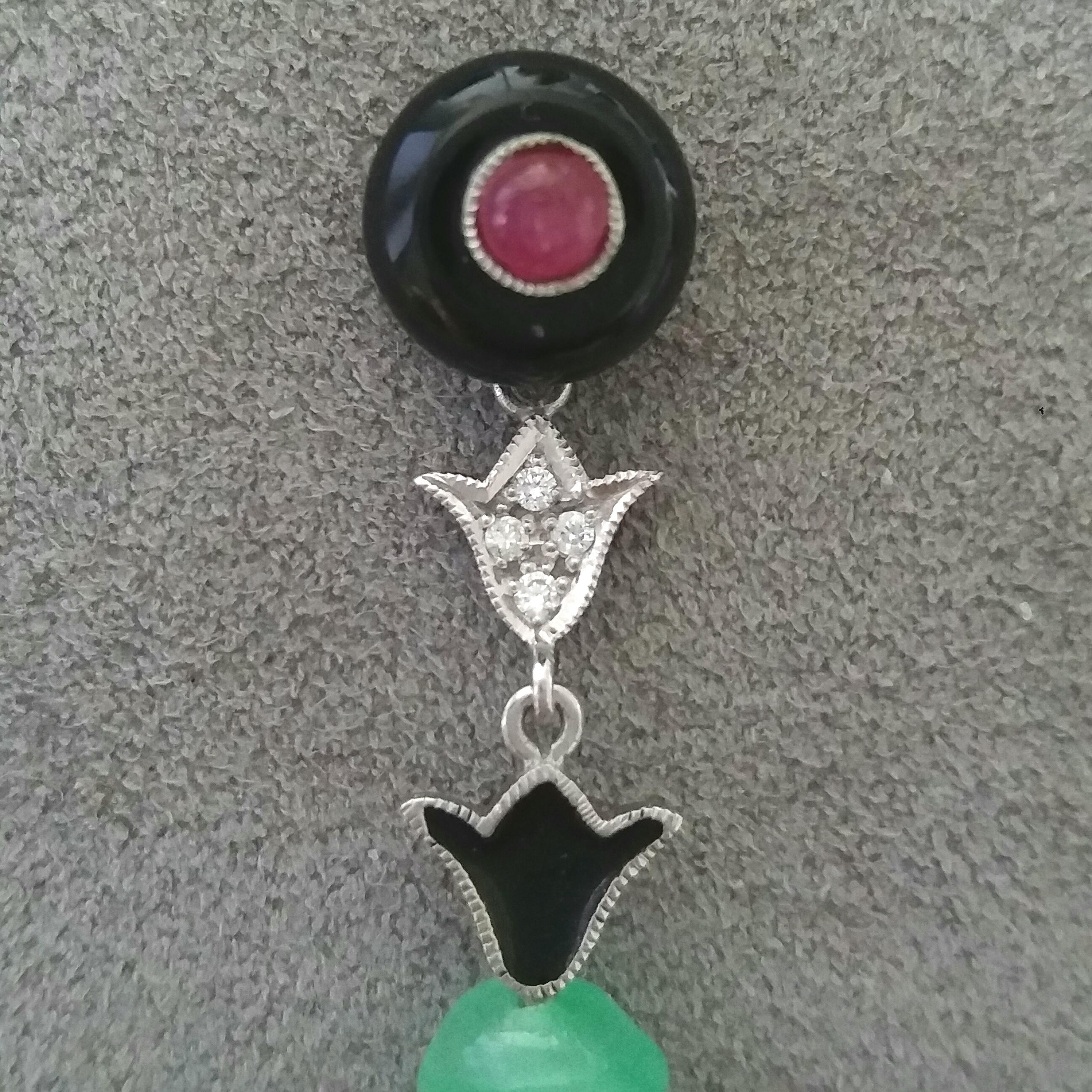 2 round black onix buttons with 2 round Ruby cabochons,middle parts in white gold ,full cut round diamonds,black enamel,bottom parts are 2 bamboo shape carved Burma Jades.

In 1978 our workshop started in Italy to make simple-chic Art Deco style