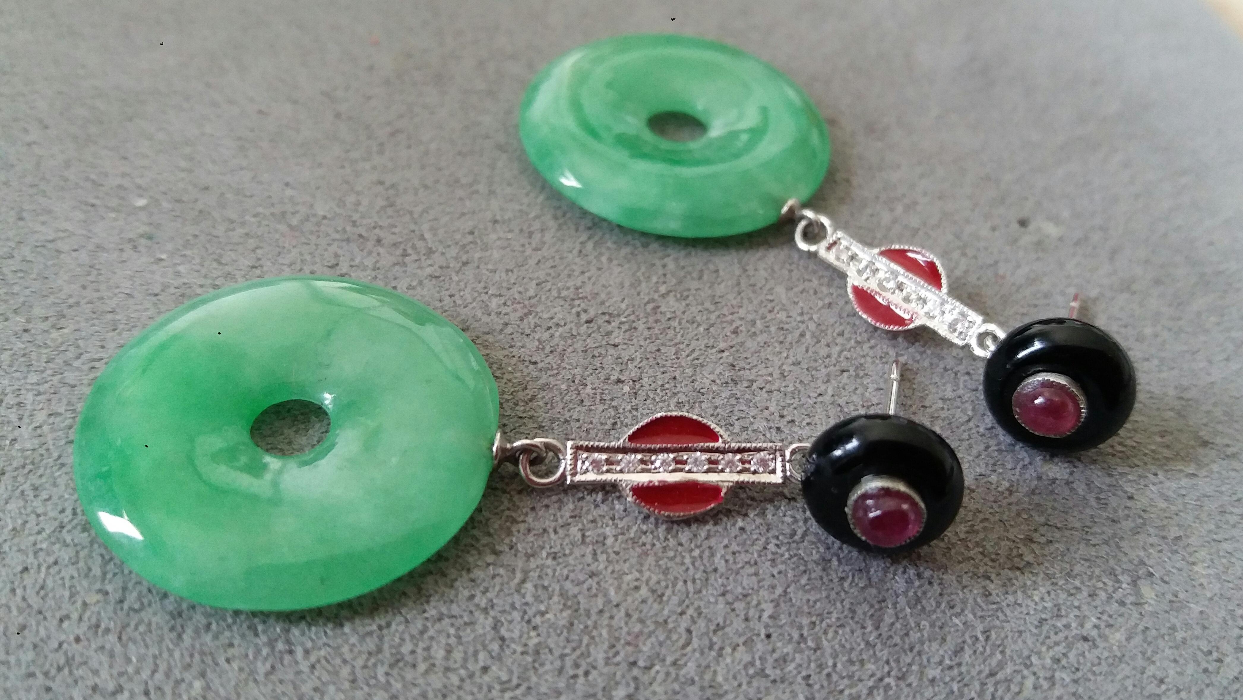 Art Deco Earrings with 2 round black onix buttons on top with small round ruby cabochons in the center,middle part in white gold ,full cut round diamonds and red Enamels, bottom parts there are 2 Burma Jade Donuts.

In 1978 our workshop started in