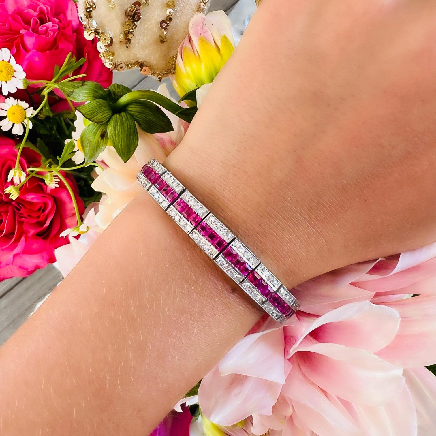 If you're looking for a genuine show stopper, your search is over! This Art Deco Platinum and 18kt gold Burma Ruby & Diamond Bracelet features 66 square cut unheated rubies weighing approximately 8.00 carats set amidst 176 sparkling round natural