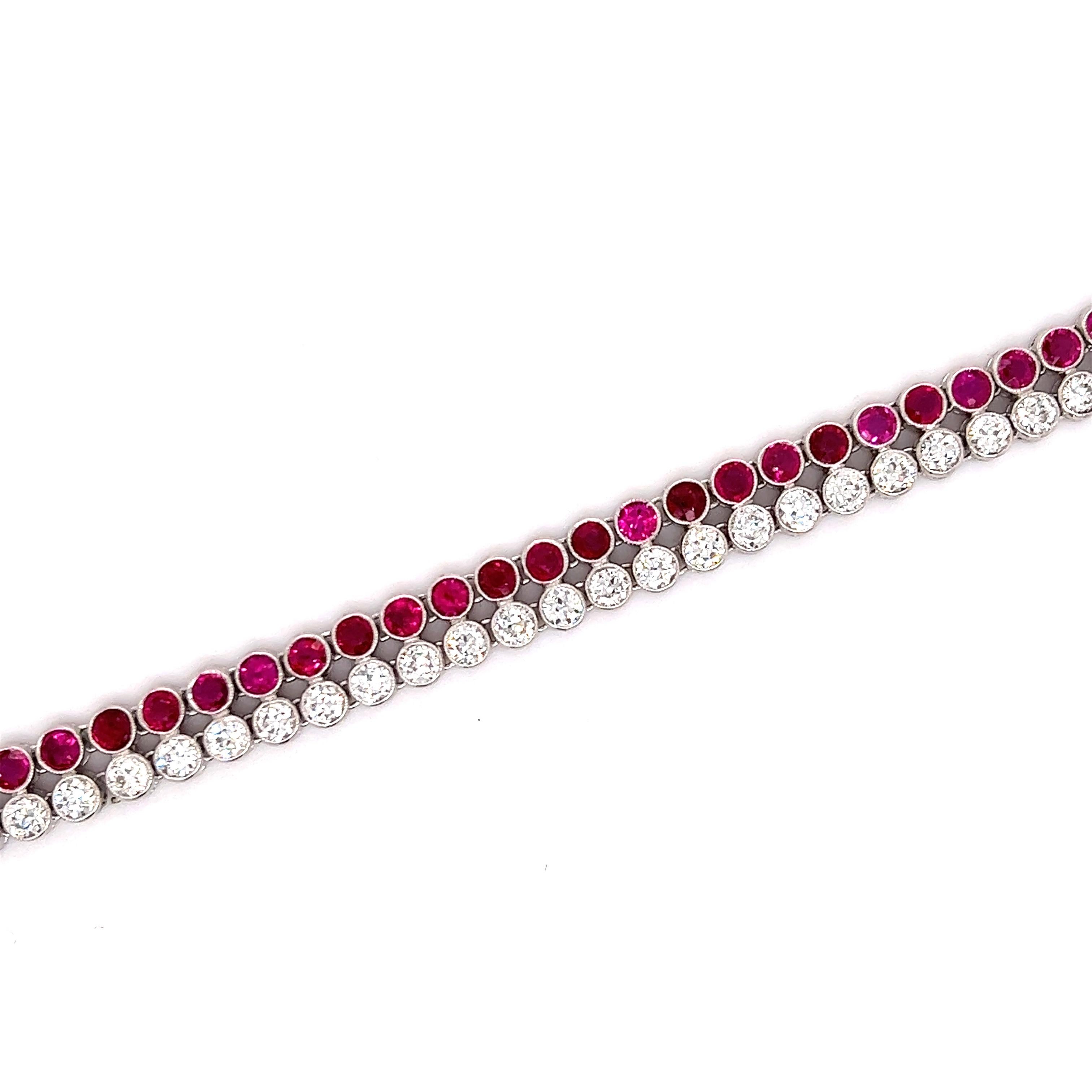 Amazing art deco creation crafted in platinum. The bracelet is set with two rows of gemstones that lay parallel next to each other. The gemstones is this bracelet are old European cut diamonds and Burmese rubies. There are approximately 4.90 ct. of