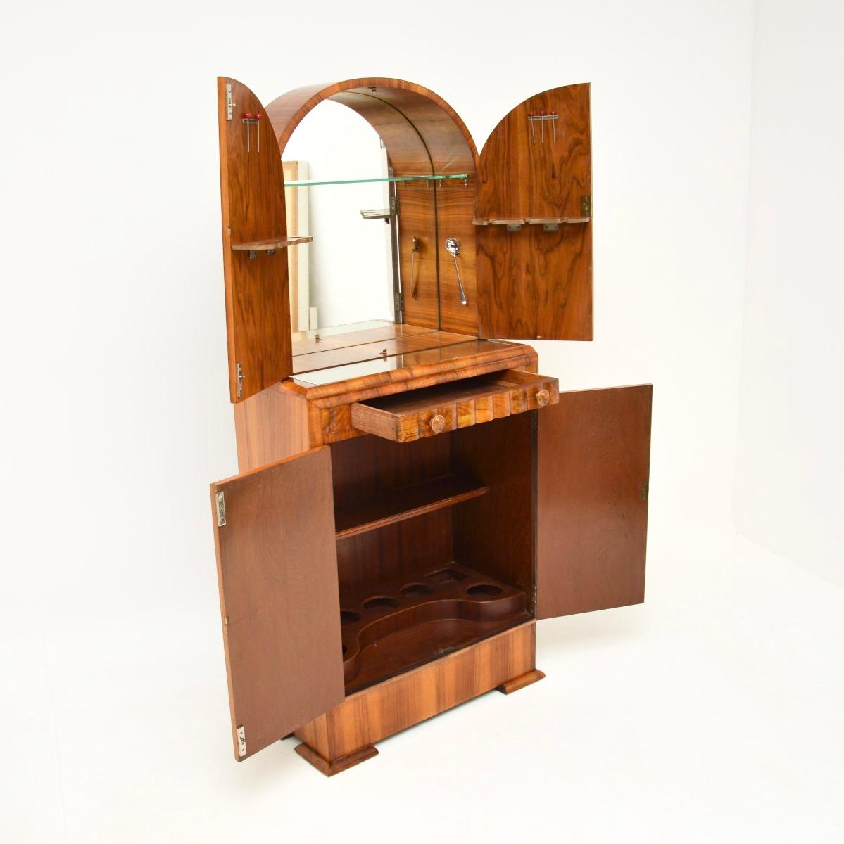An absolutely stunning Art Deco burr walnut cocktail drinks cabinet, made in England and dating from the 1930’s.

This is of superb quality and is a lovely compact size. It is beautifully designed and has absolutely gorgeous burr walnut grain