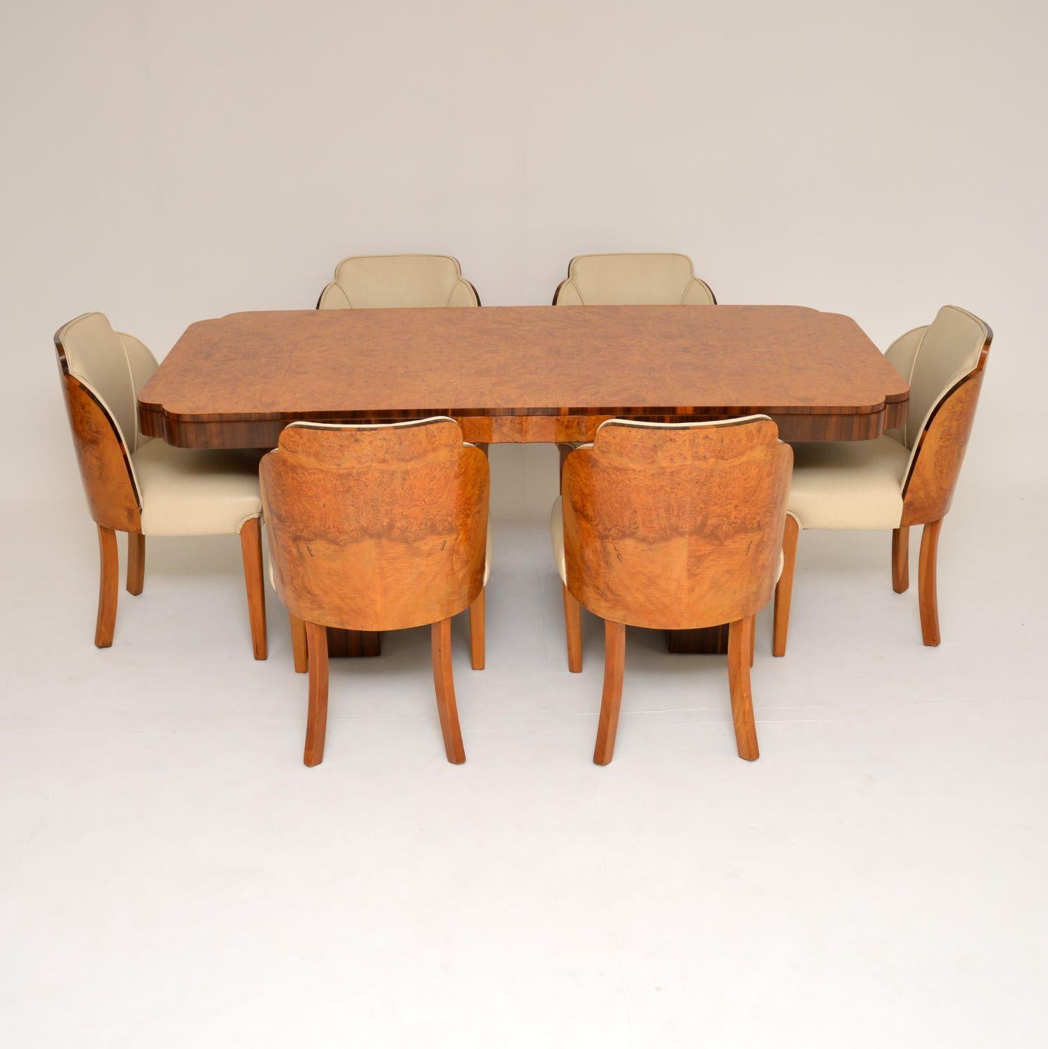 A stunning original Art Deco period walnut dining suite by Epstein. This consists of six amazing cloud back dining chairs, and a twin pedestal dining table.

The quality is absolutely outstanding, and this has a strikingly beautiful design. It is