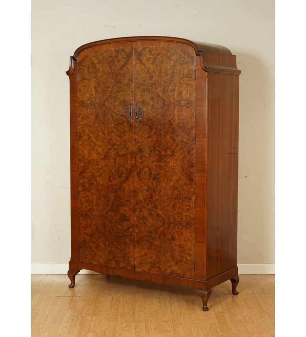 We are delighted to offer for sale this Art Deco burr walnut double wardrobe.

A very lovely solid and well-made wardrobe, there is damage on side of the wardrobe which has three lines across, apart from that, the rest of the wardrobe is in a good