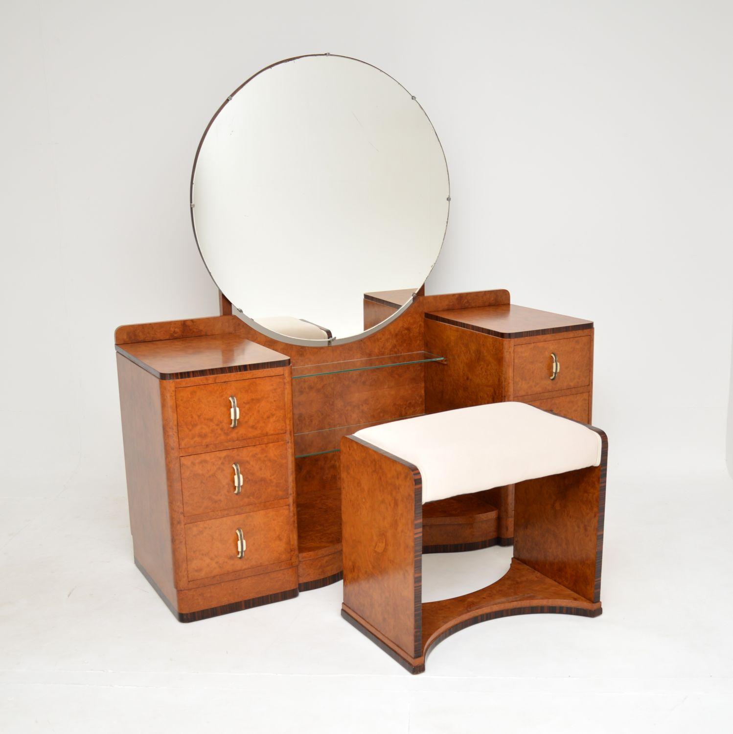 A stunning original Art Deco period dressing table with matching stool. This was made in England, it dates from the 1930’s.
The quality is outstanding, this is beautifully made from burr walnut, with rosewood banding around the edges. The dressing