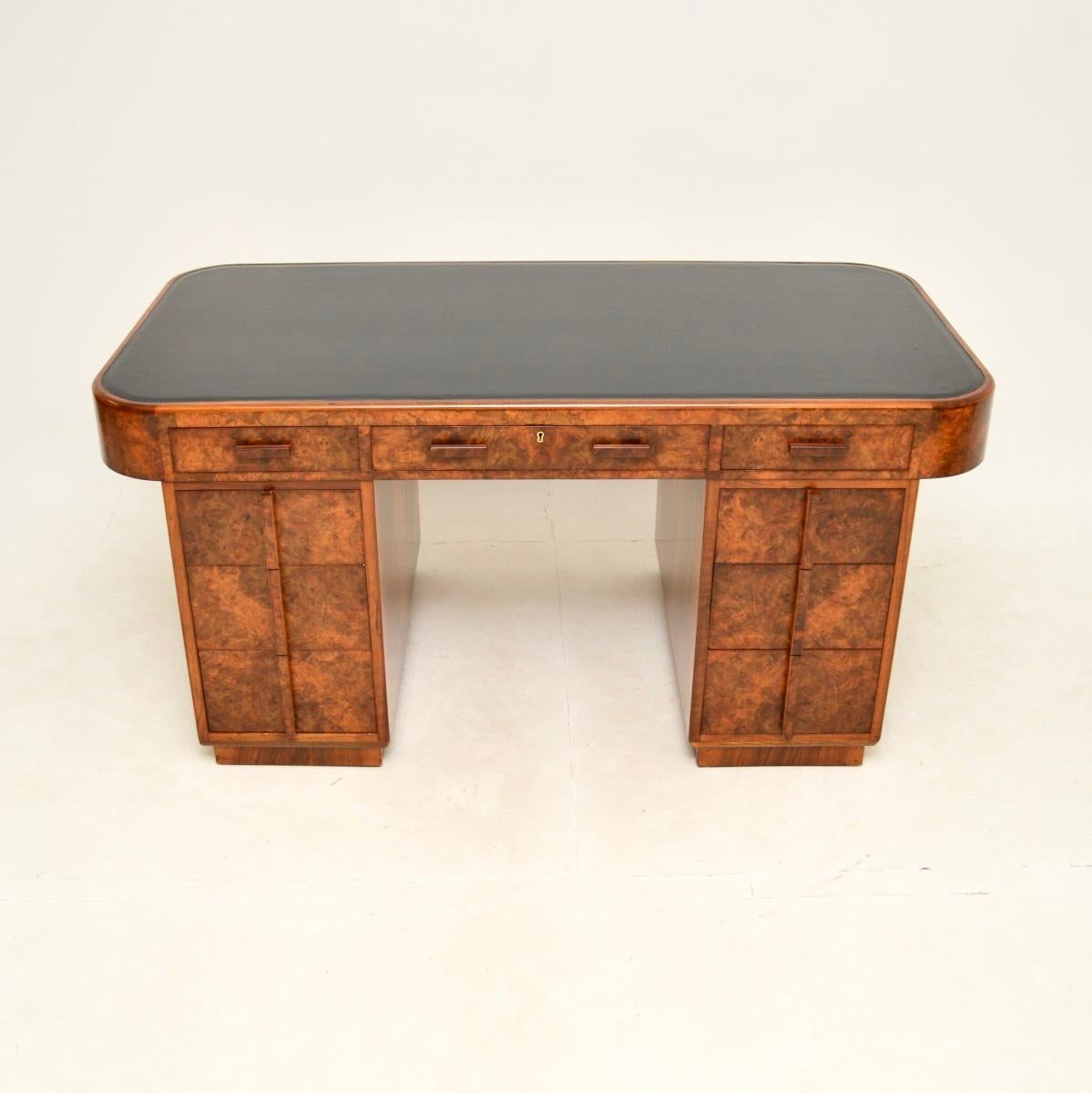 An absolutely magnificent Art Deco burr walnut leather top partners desk. This was made in England, it dates from the 1920-30’s.

The quality is outstanding, this has an extremely impressive and interesting design and it is one of the finest