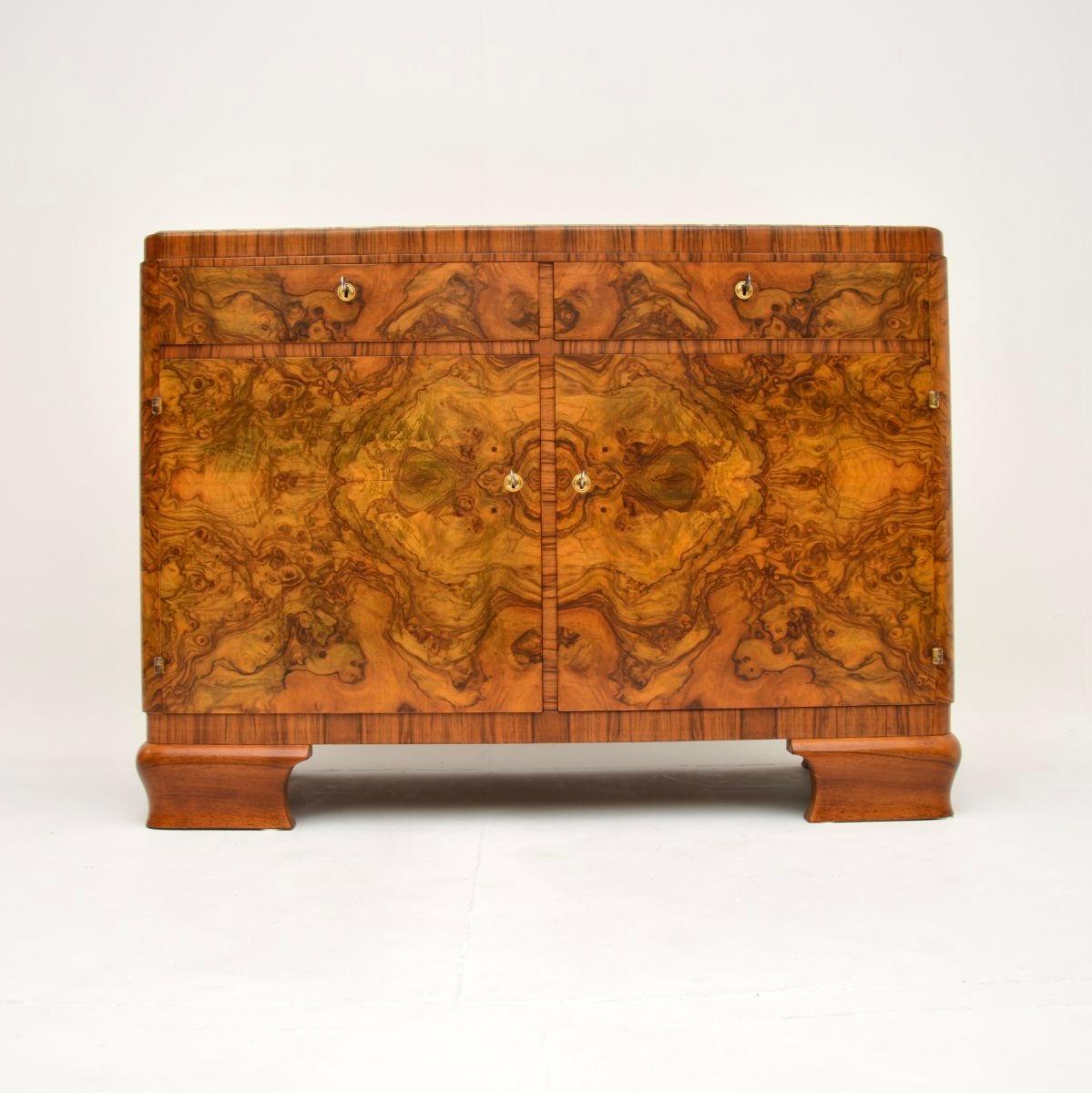 An absolutely stunning and extremely well made Art Deco burr walnut marble top sideboard. This was made in France, it dates from the 1920-30’s.

The quality is outstanding, this is beautifully made and has lovely proportions. The burr walnut colour