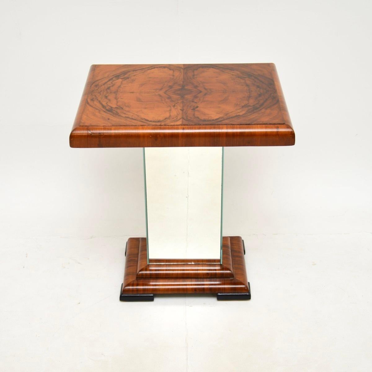 A wonderful Art Deco burr walnut mirrored occasional side table. This was made in England, it dates from the 1930’s.

It is of superb quality and is a very useful size. The walnut grain patterns are gorgeous, this is nicely finished on all sides.