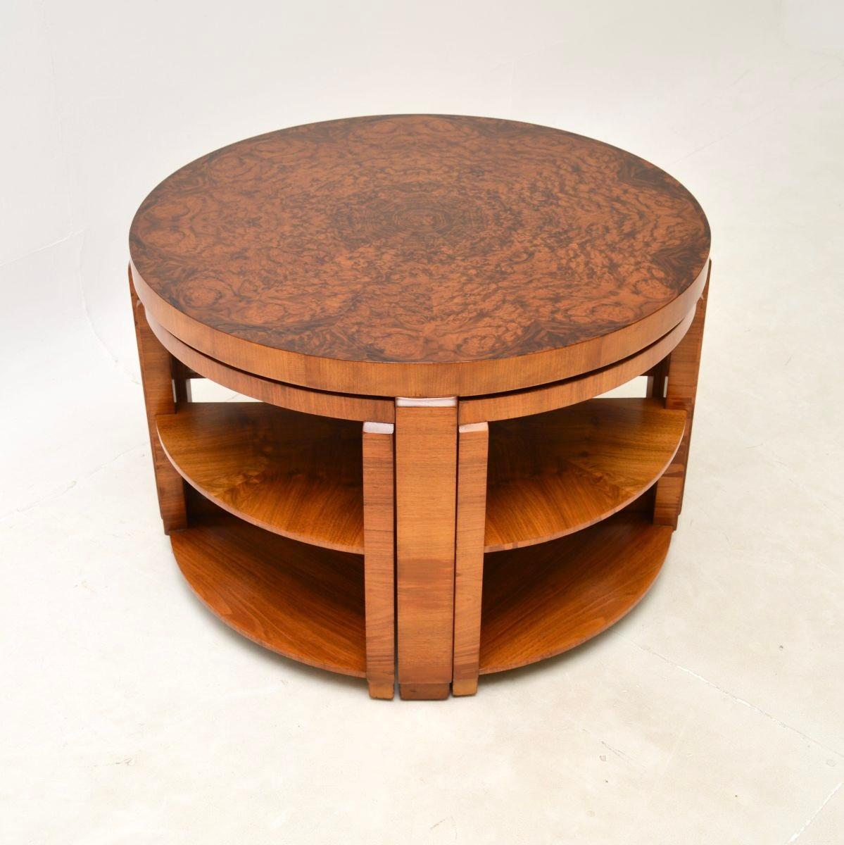 A stylish and extremely well made Art Deco burr walnut nesting coffee table. This was made in England, it dates from the 1920’s.

The quality is outstanding, this has a gorgeous design and is very practical. The four smaller pie shaped tables nest