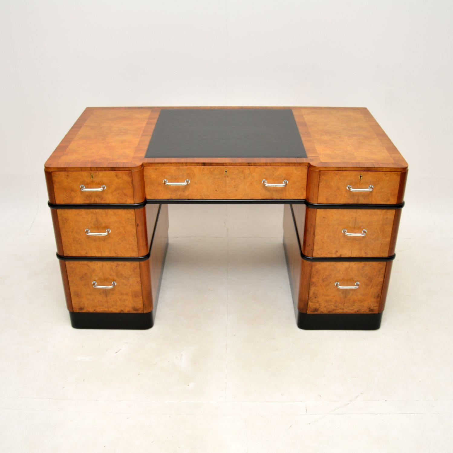 A magnificent Art Deco burr walnut pedestal desk. This was made in England, it dates from around the 1920-30’s.

The quality is outstanding, this is a large and impressive size. There are beautiful burr walnut grain patterns on the top and drawer