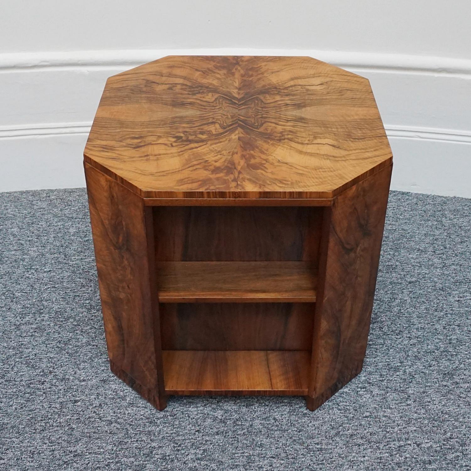 An Art Deco library table by Heal's of London. Burr walnut veneered with figured walnut banding on solid mahogany. 

Dimensions: H 58.5cm W 59cm D 59cm

Origin: English

Date: Circa 1935

Founded by John Harris Heal 1810, Heal’s London has