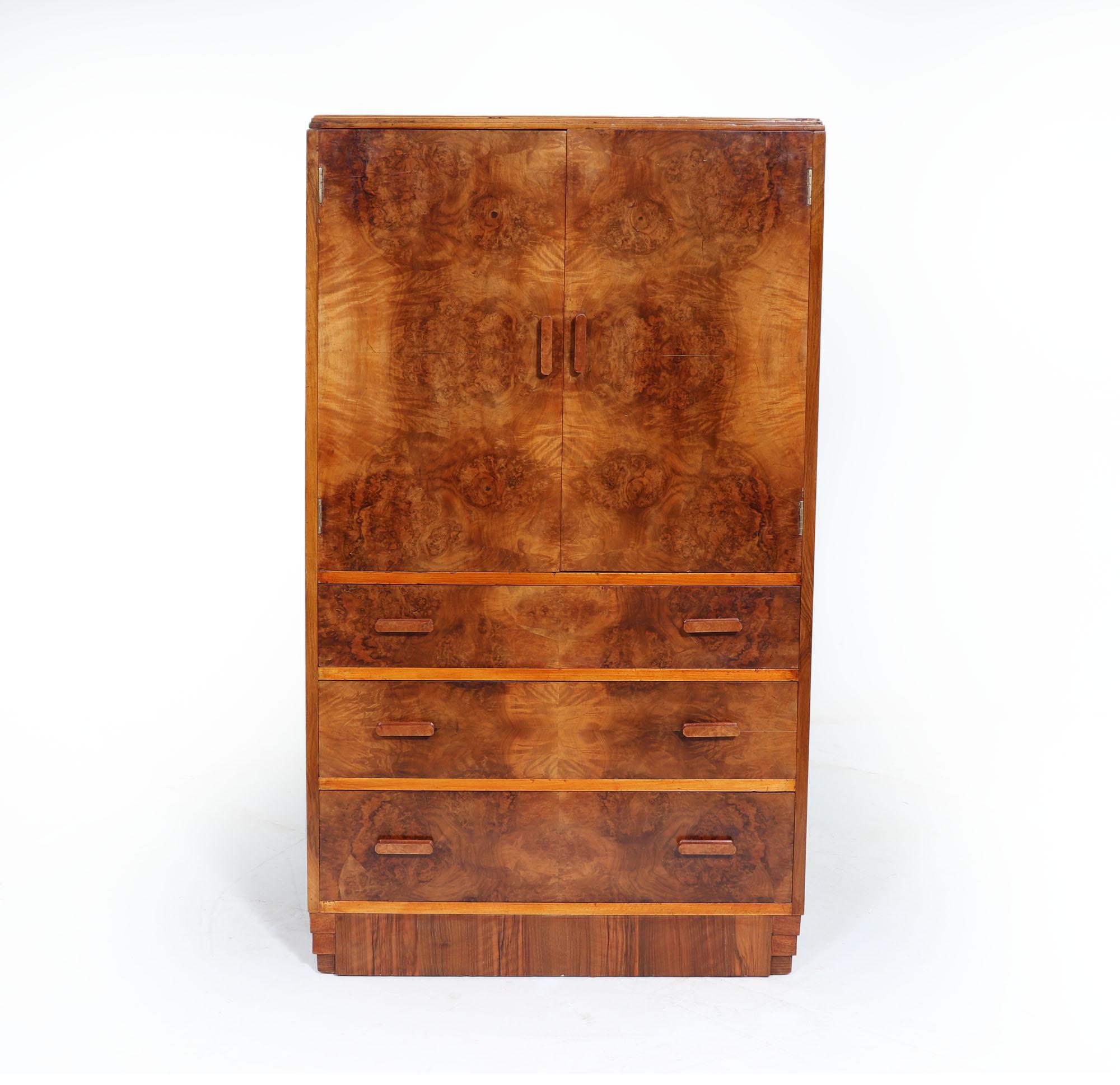 ART DECO TALLBOY CABINET
A burr walnut tallboy produced in England in the 1930’s, the top lifts up to reveal a sectioned top with original mirror, below are cupboards with shelved behind and six long dovetail jointed drawers under this these all