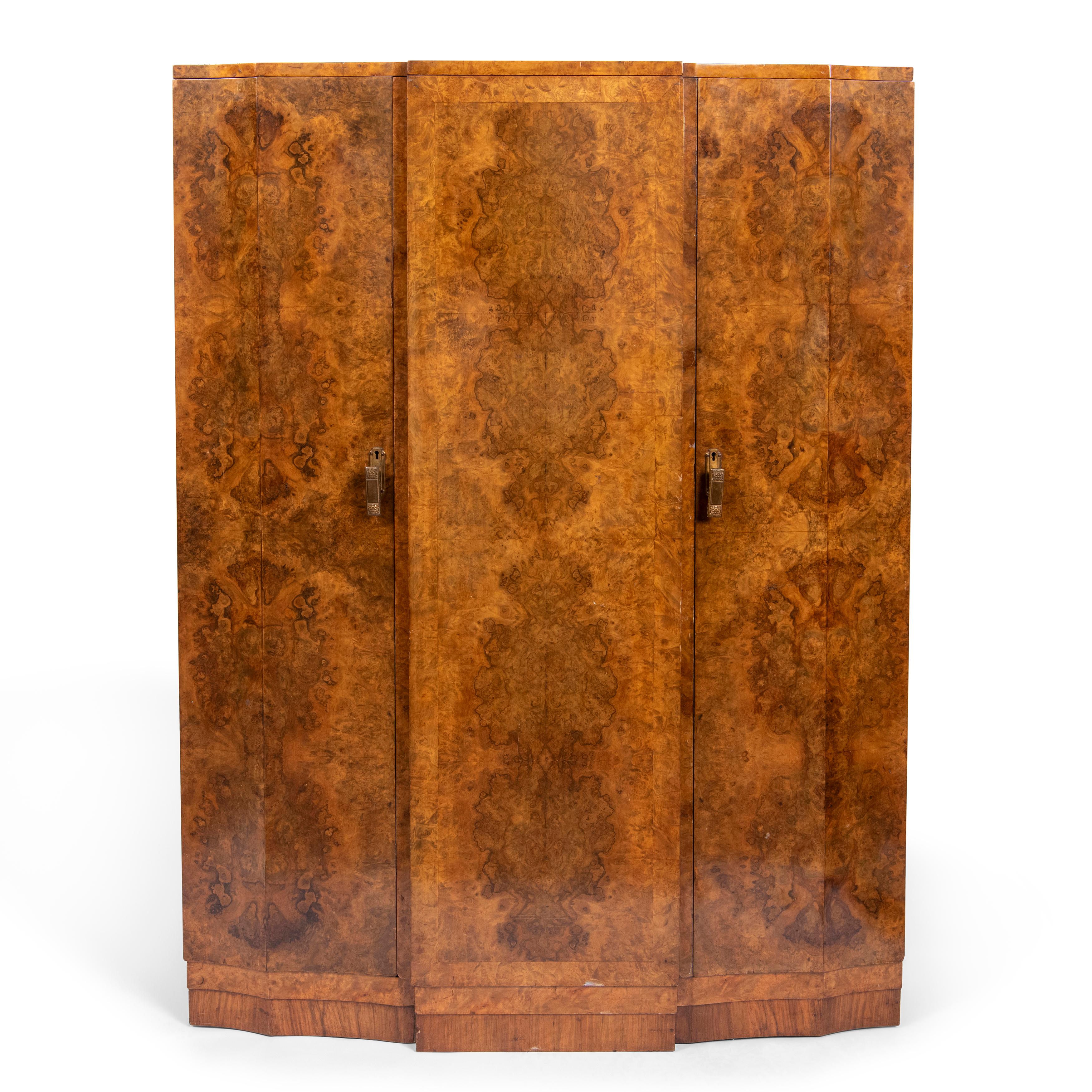 Art Deco Burr Walnut Wardrobe, England circa 1925
Mahogany interior with chased silvered metal handles.
152 cm high x 107 cm wide x 53 cm deep
