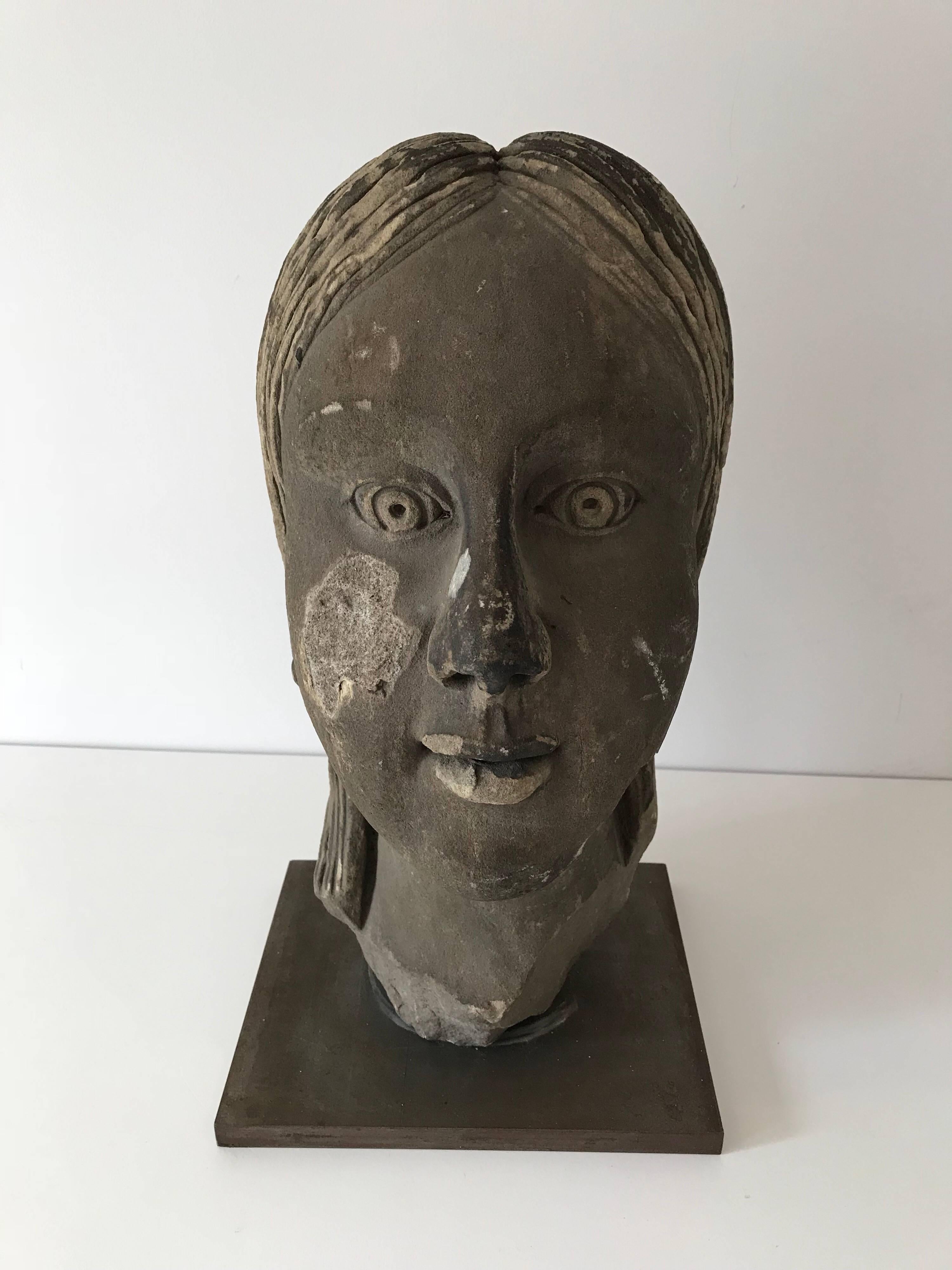 Interesting and fun Art Deco period bust, originally from a larger statue. Now mounted on heavy steel base.