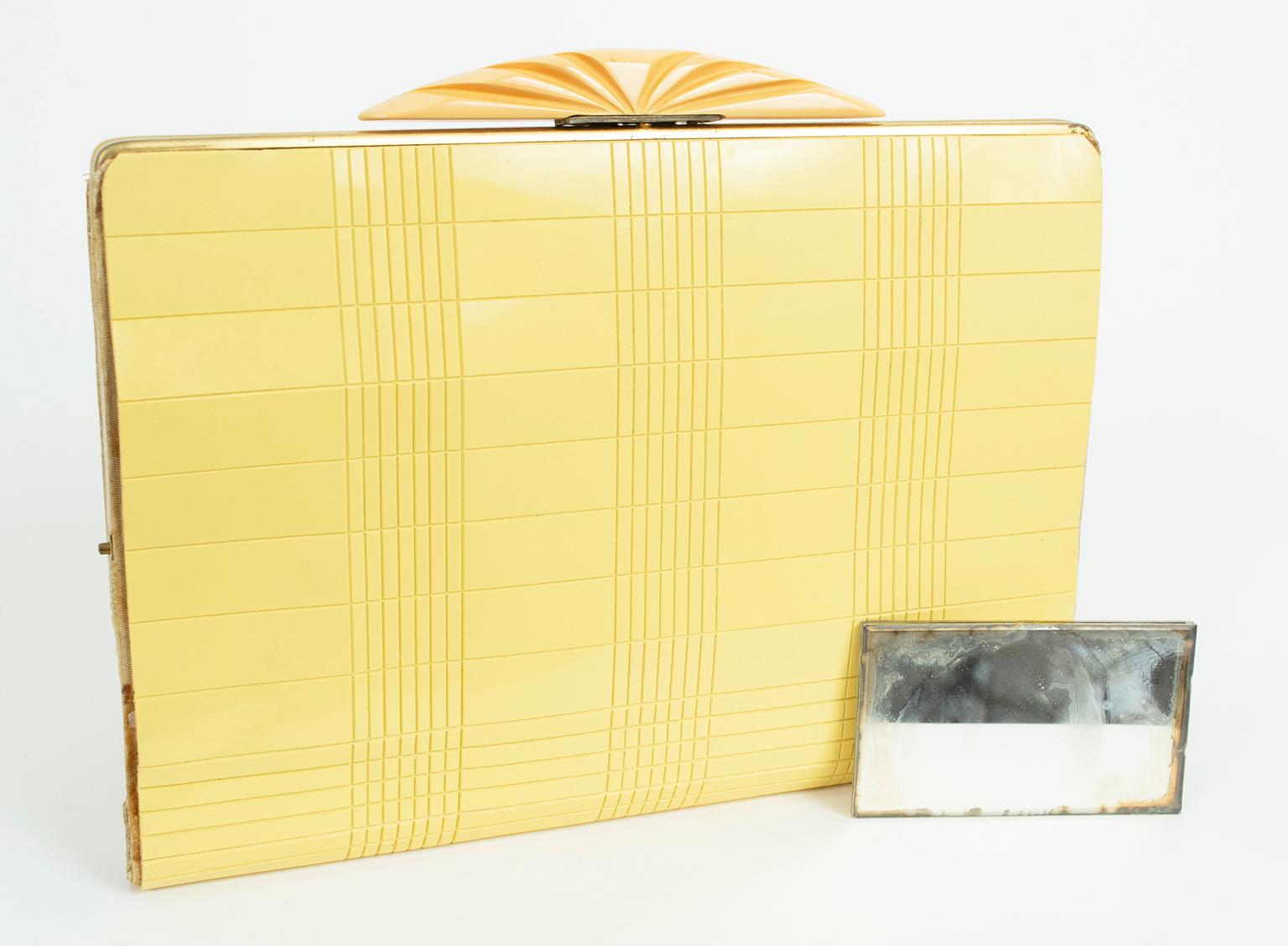From its buttery color to its Moderne grooved surface to its exquisite carved Bakelite clasp, this day or evening clutch is a statement accessory that speaks volumes in style. Pairs beautifully with our stack of butterscotch carved Bakelite bangles,