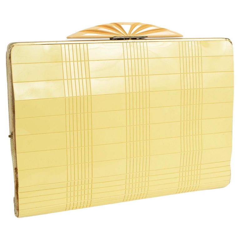 Art Deco Buttercream Grid Vinyl Dance Clutch with Carved Bakelite Clasp, 1930s For Sale