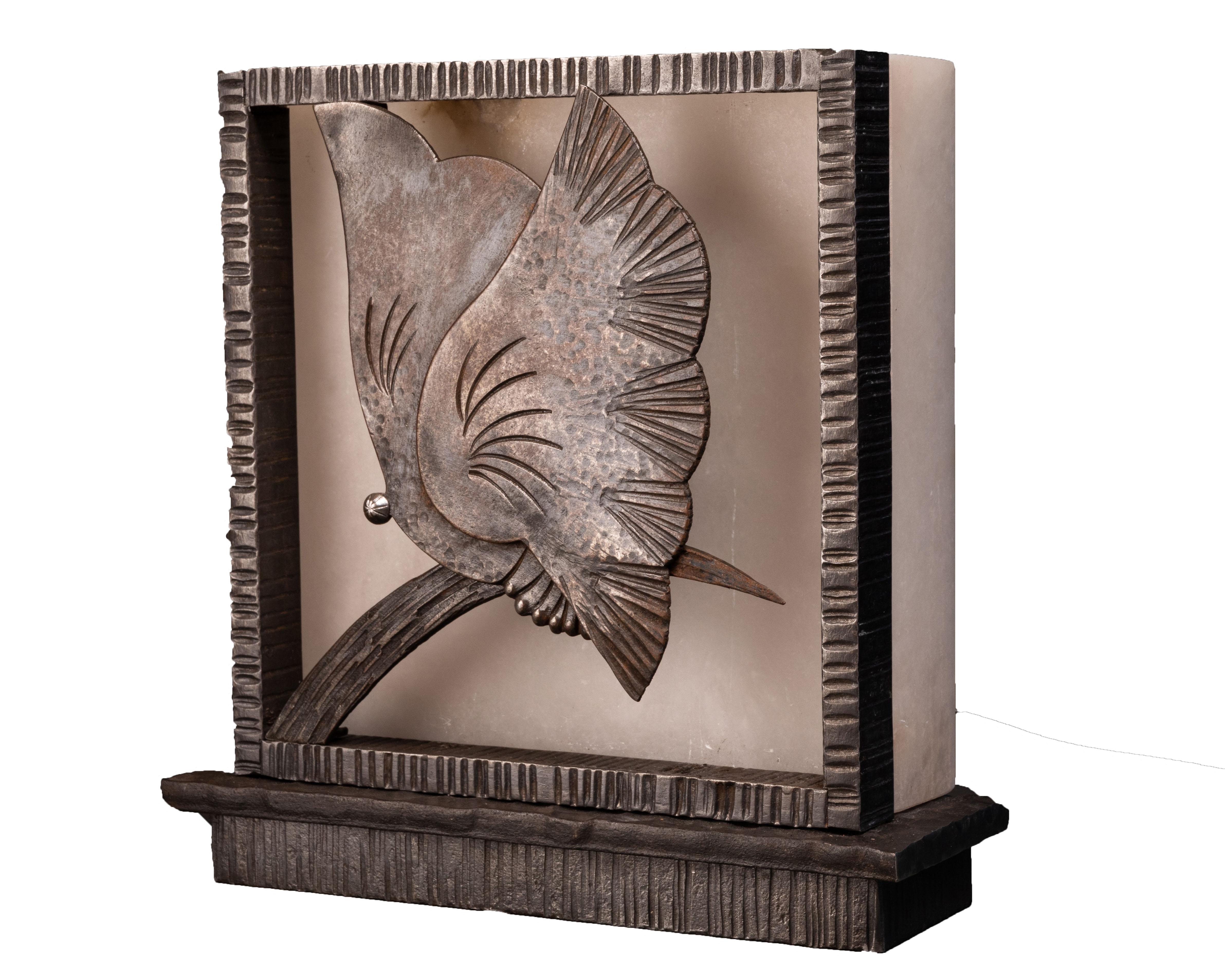 Art Deco butterfly lamp or sconce in wrought iron and alabaster by Edgar Brandt (you can read more about the artist below).

Animal sculpture and Art Deco lamp (or wall lamp) decorated with a butterfly in hammered and chiseled wrought iron.

A