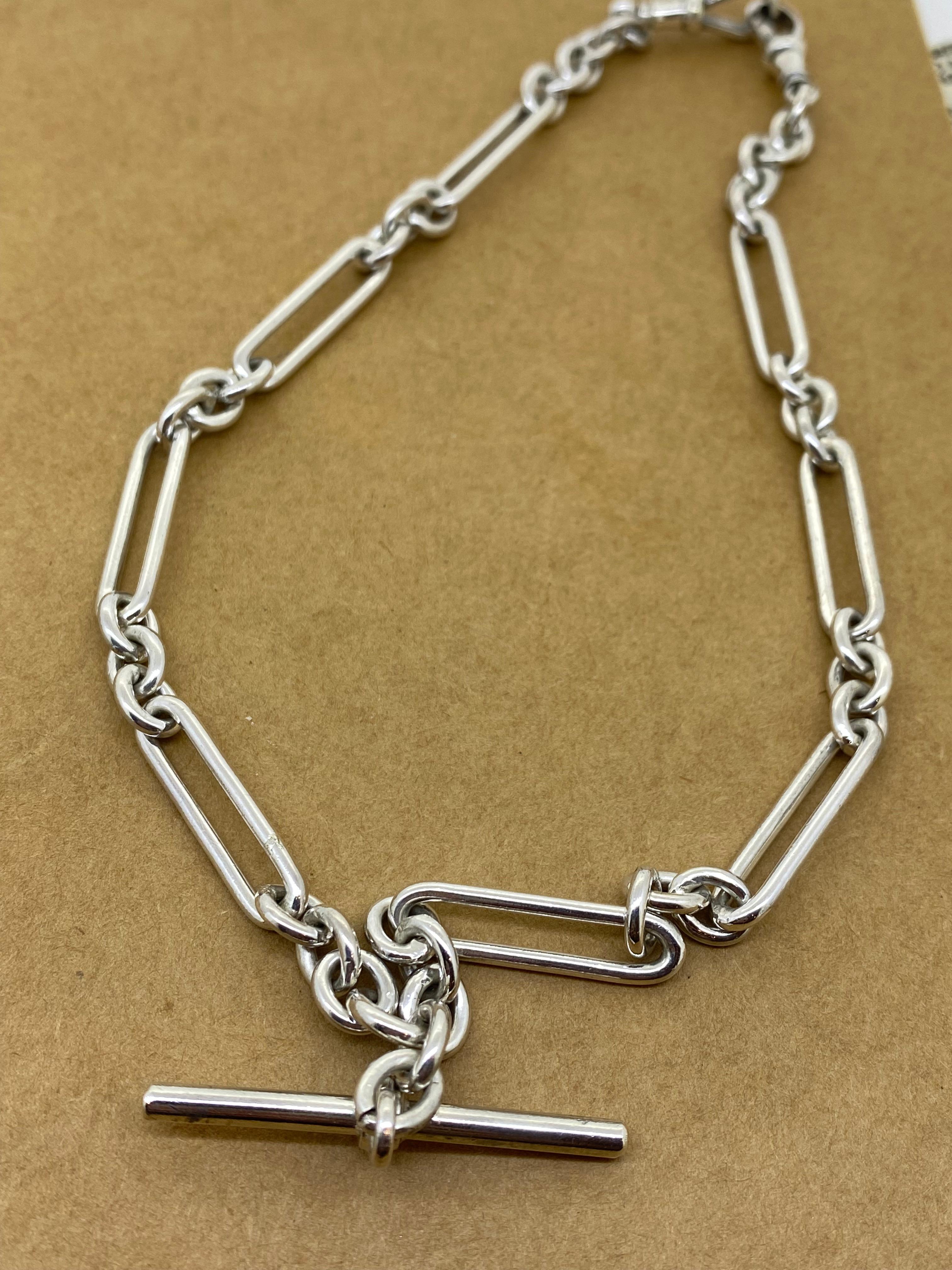 Magnificent Fob / Albert Chain, 
meticulously crafted in 925 Sterling Silver, 
featuring an intricate T-bar pendant, stamped

Featuring elongated trombone links, 
alternating with cable links.
Each elongated link measures 2.5cm & is stamped
necklace