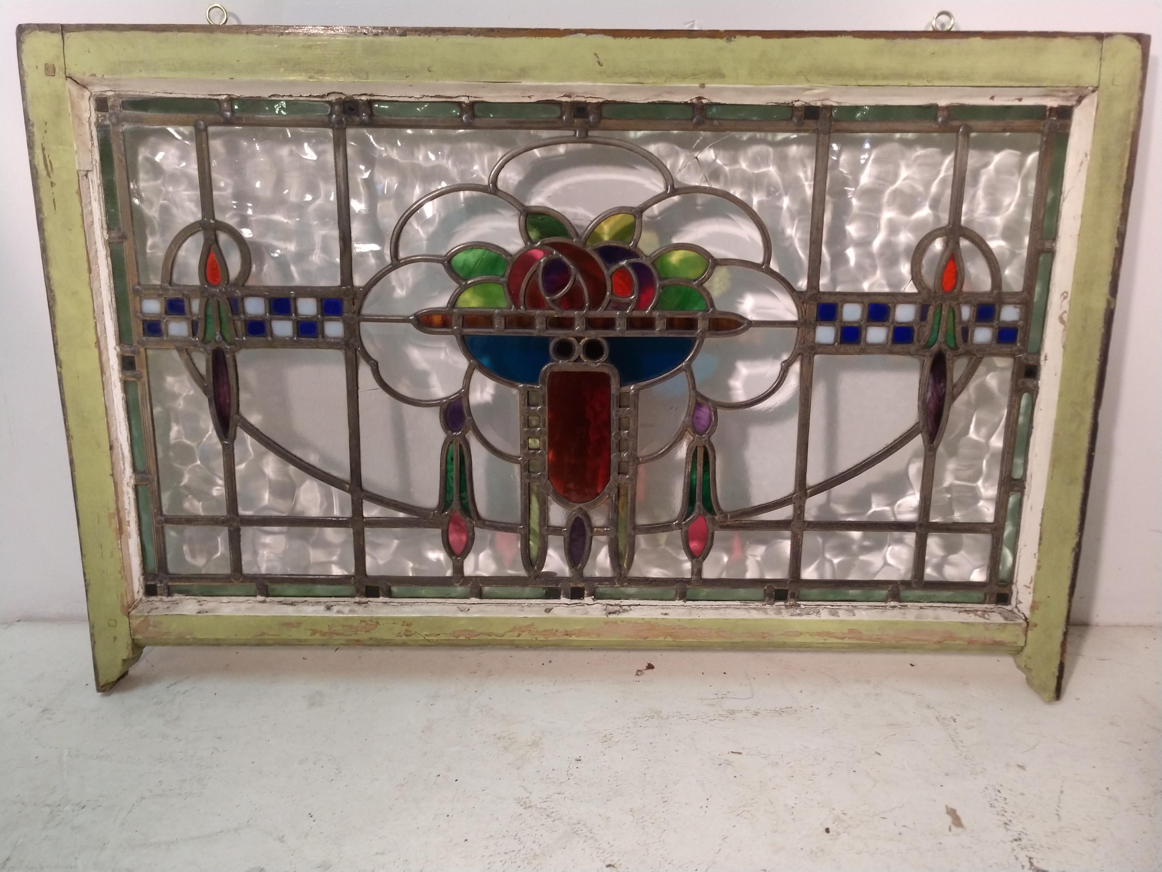 Beautiful depiction of a true Art Deco stained glass window with clear beveled and textured glass. Some (3) cracks in the window, pictured.