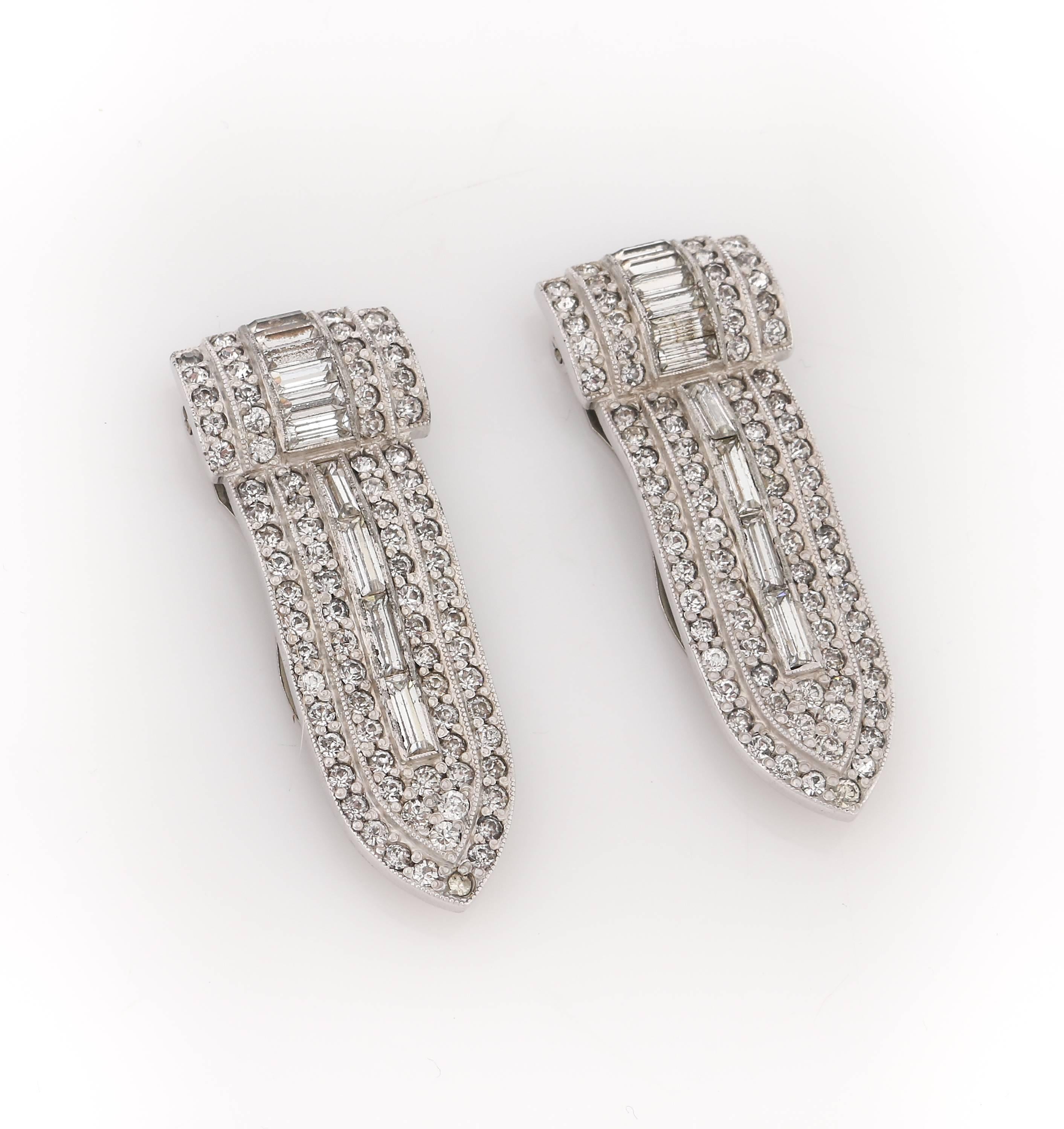 Vintage Art Deco c.1930's two piece palladium silver (over cut steel) diamond-look crystal rhinestone dress / fur clips set. Palladium silver-toned metal pointed oblong shaped setting with two rows of paved set round crystal rhinestones surrounding