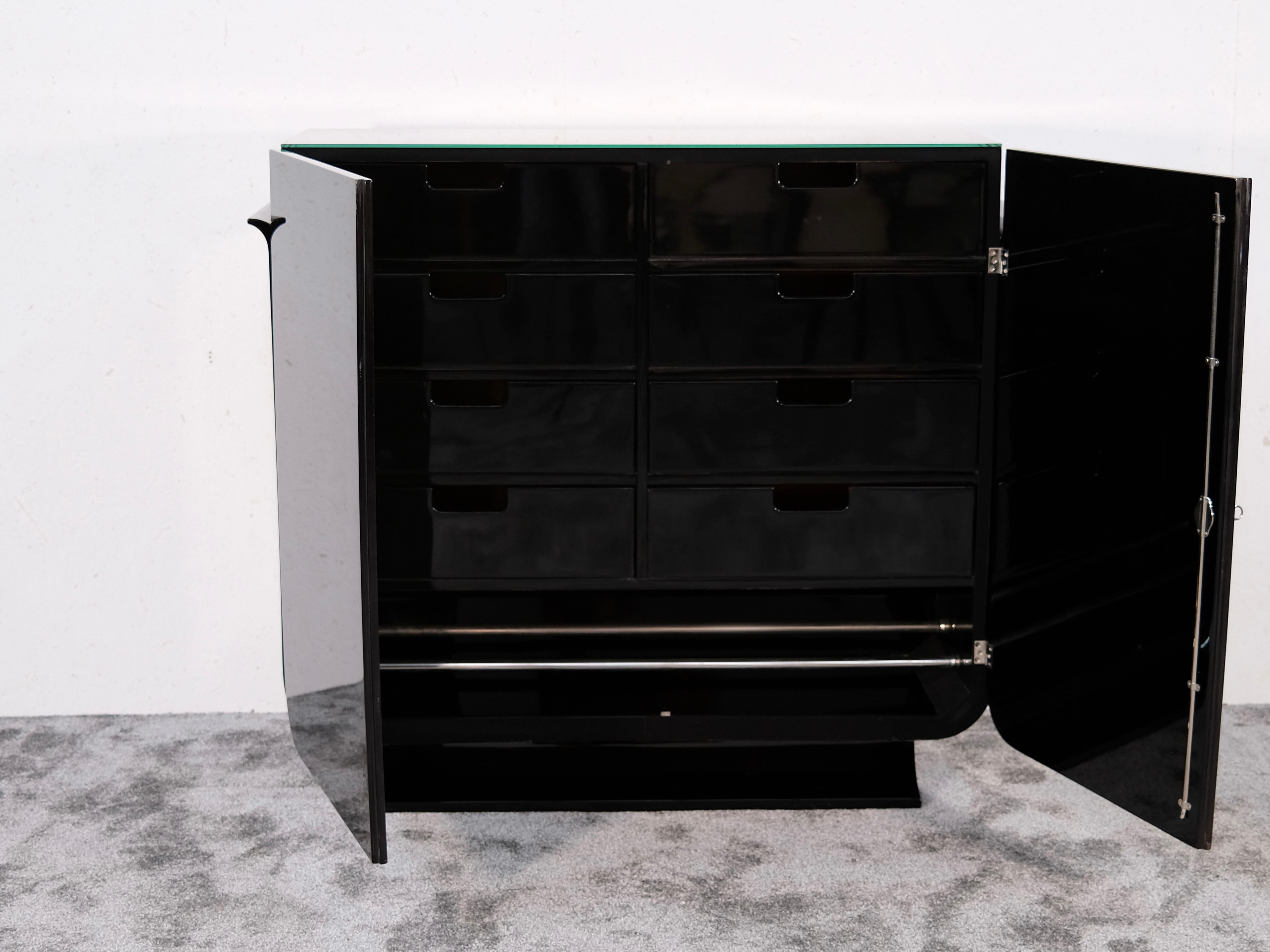This elegant French Art Deco cabinet from the 1930s offers a rare blend of refined style and clever functionality. With its compact footprint and thoughtful internal layout, it serves as the ideal entryway cabinet, hallway storage piece, or luxury