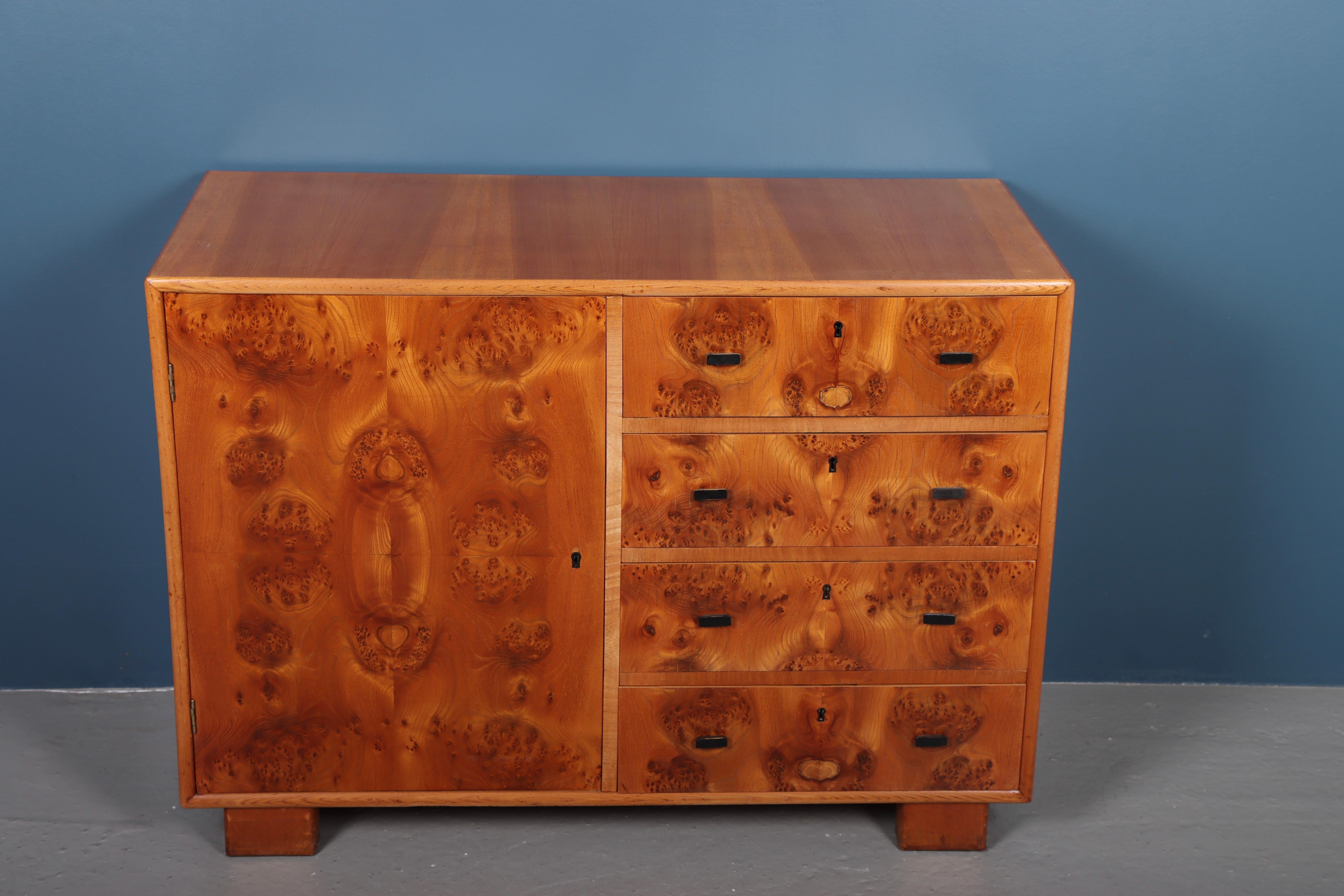 Cabinet in elm wood, design and made in Denmark 1930s. Great original condition.