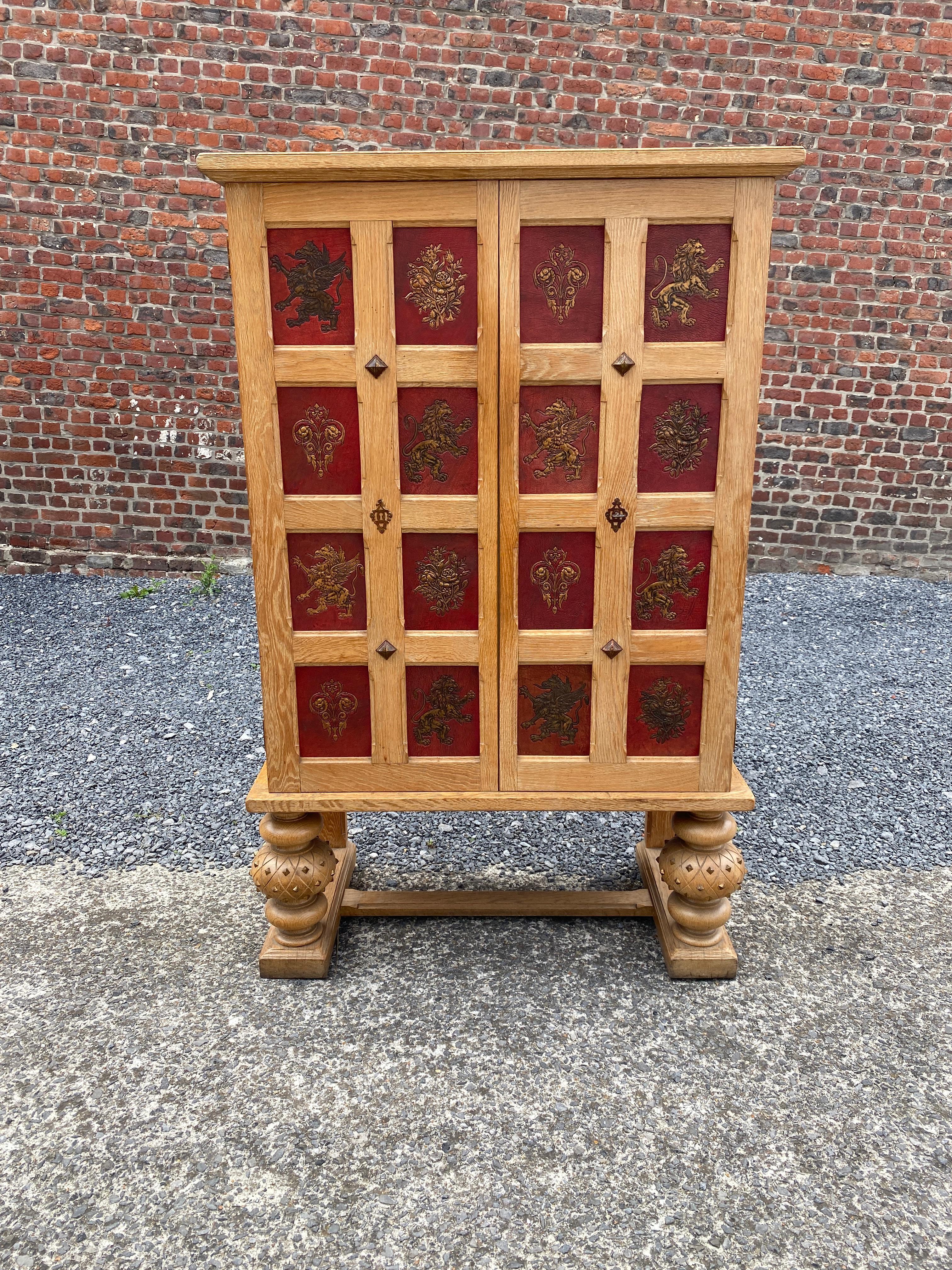 Art Deco cabinet in oak and embossed and gilded leather, circa 1940-1950.