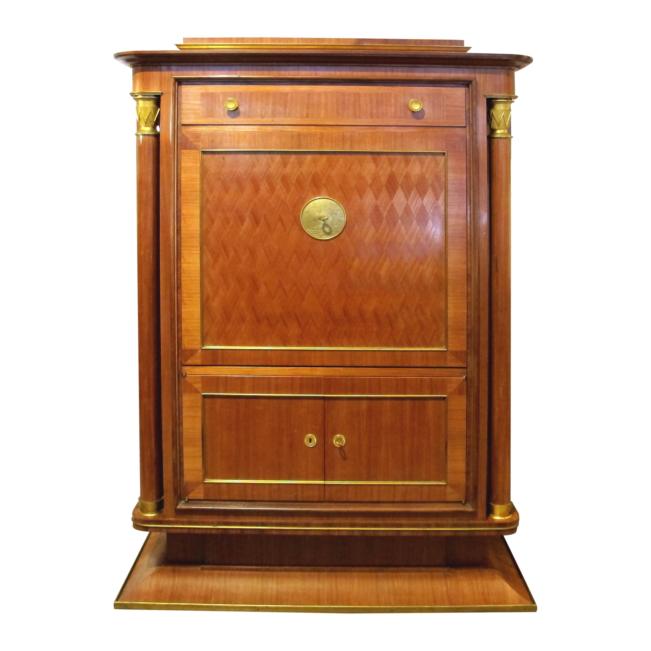 Presenting a meticulously crafted, remarkable piece of Art Deco craftsmanship, this 1930s exceptional cabinet secretaire attributed to Jules Leleu (1883-1961), captures the essence of a bygone era. A stunning fusion of artistic mastery and