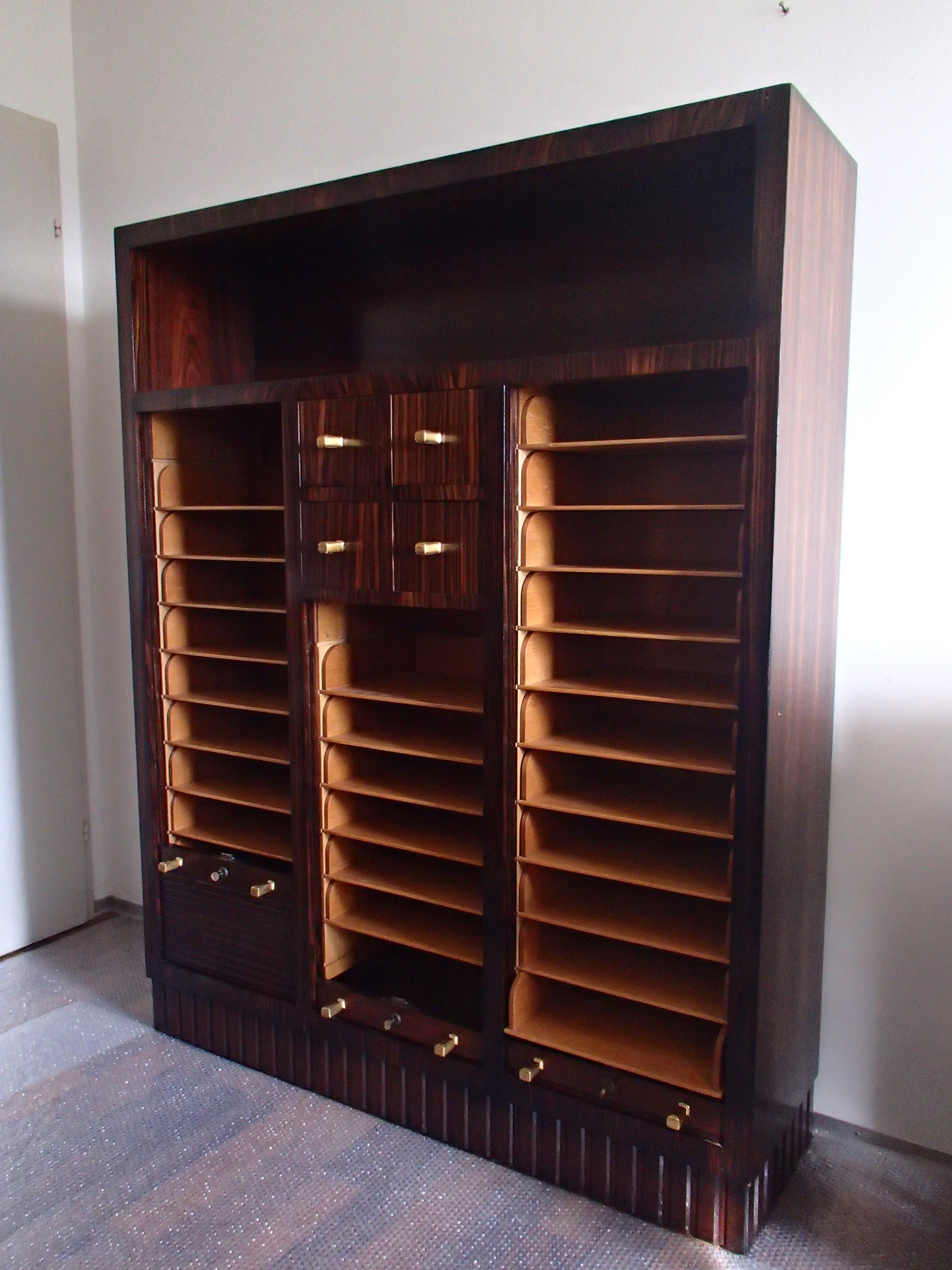 Modern Art Deco cabinet with 27 oak drawers where you may put A4 papaers or folders.
The 4 small drawers are perfect for CD's.
 