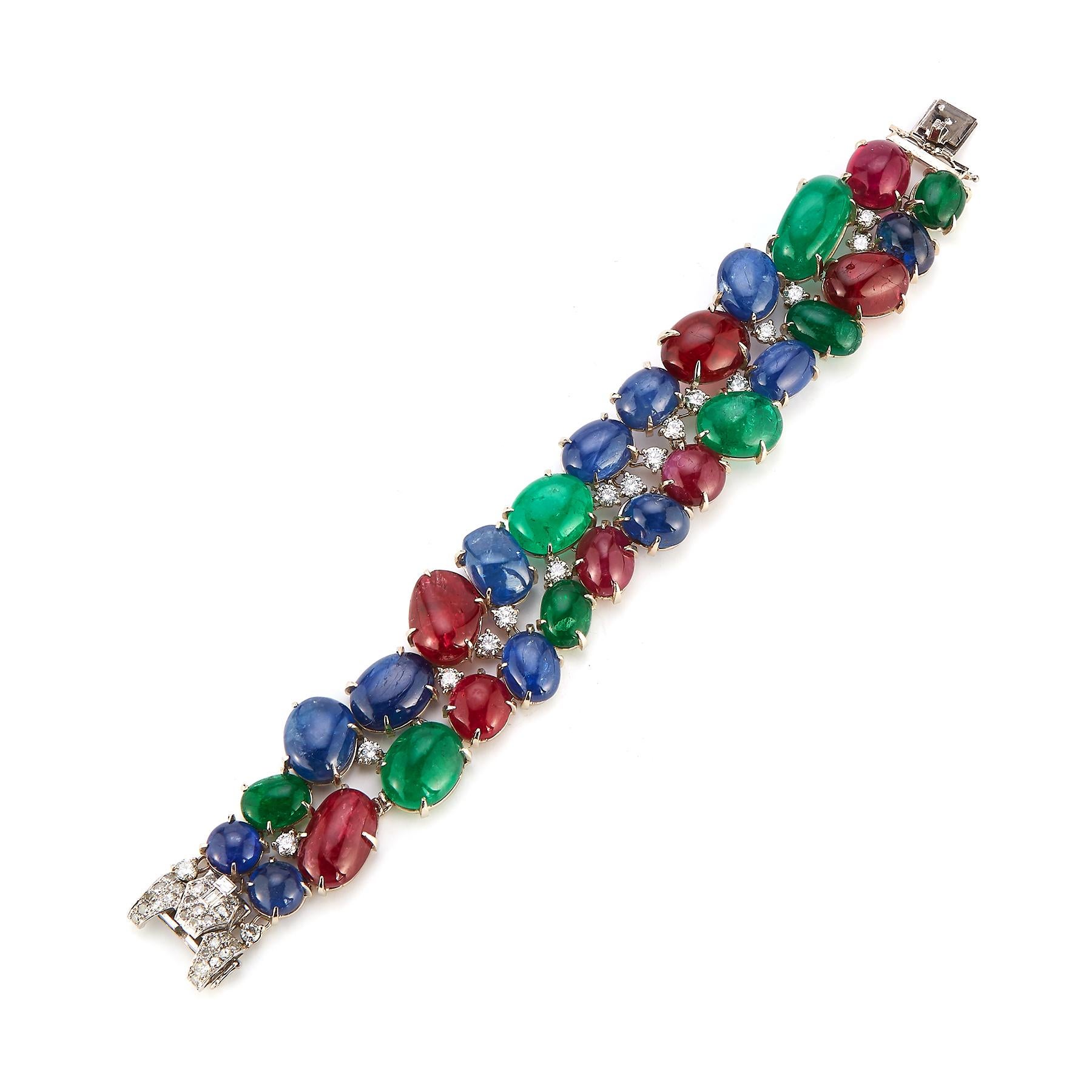 Art Deco Cabochon Tutti Frutti Bracelet

This bracelet features a vibrant display of sapphires, emeralds, spinels and diamonds, set in platinum.

Made in France Circa 1925

Measurements: approximately 7.25 inches long