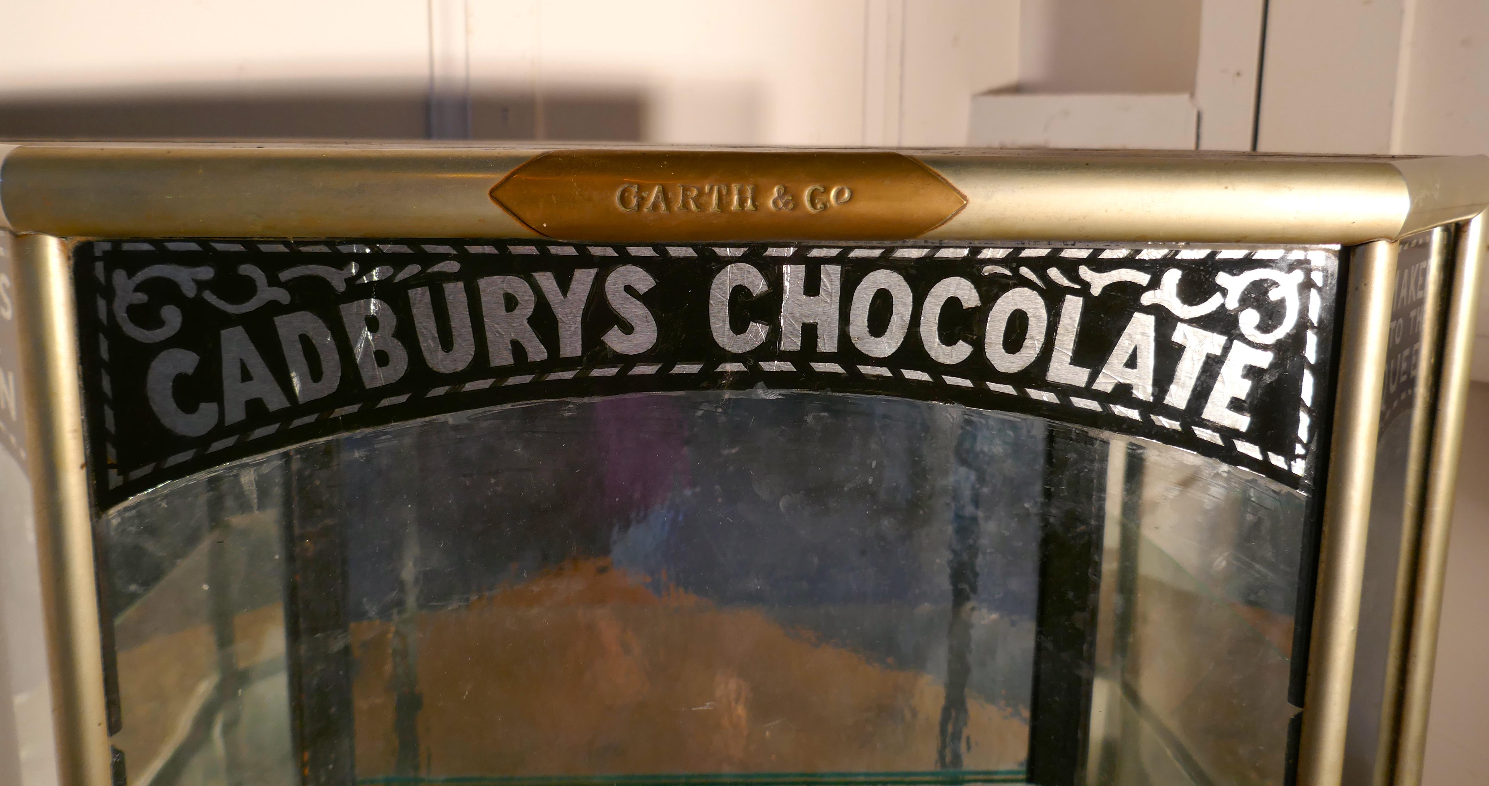 Art Deco Cadbury’s sweet shop display cabinet.

This a small but charming Cadbury’s sweet shop display cabinet it is a counter top piece, it is in the shape of a Convex Hexagon, with a small door at each end,
The cabinet has a chrome trimmed