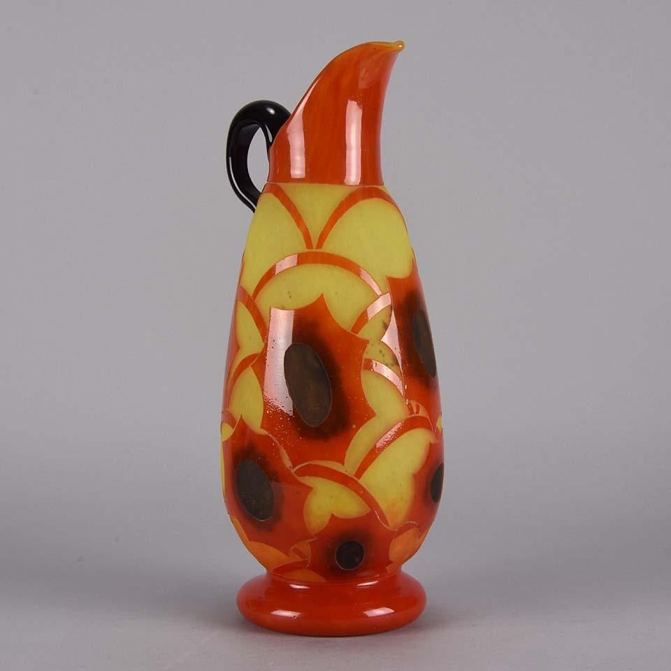A beautiful cameo glass Art Deco Schneider jug decorated with a striking red floral pattern against a vibrant yellow field with fine colors and excellent detail, signed Le Verre Francais


Charles and Ernest Schneider (French, early 20th century)