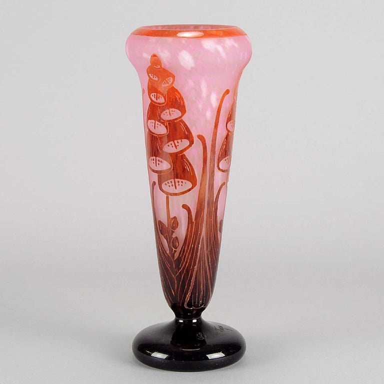 A very striking cameo glass vase decorated with a red and maroon Art Deco floral design against a light pink field with excellent colour and very fine detail, signed Le Verre Francais


Charles and Ernest Schneider (French, Early 20th Century)