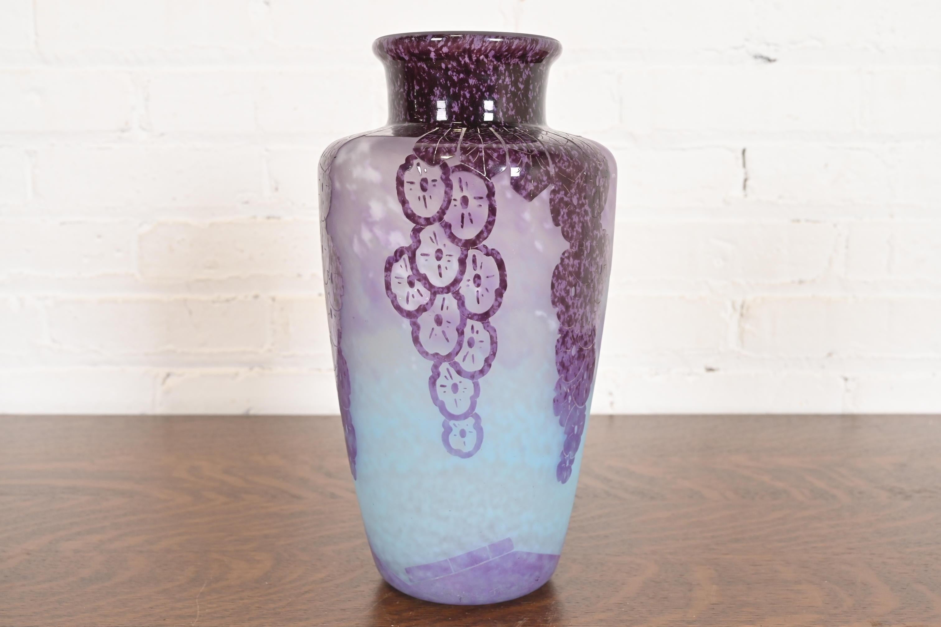 A rare and exceptional Art Deco period cameo glass vase featuring a floral design in various shades of purple and light blue

Imported by high end retailer Ovington Brothers of New York

By Charles Schneider for Le Verre Français 

France,