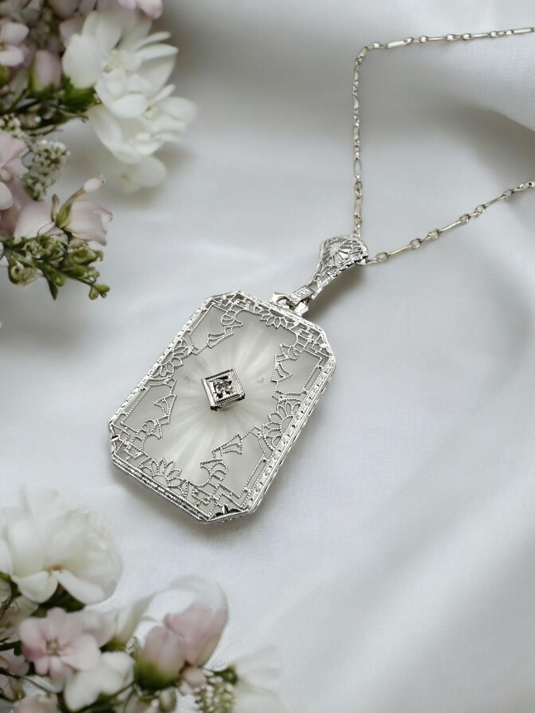 We are truly in love with this exquisite pendant! 
She just makes for the perfect statement piece.

Pendant Details  
Material: 14K White Gold
Era: Art Deco 1920 - 1940
Pendant Length: 1 5/8 Inches
Pendant Width: 3/4 Inch
Chain Length: 17