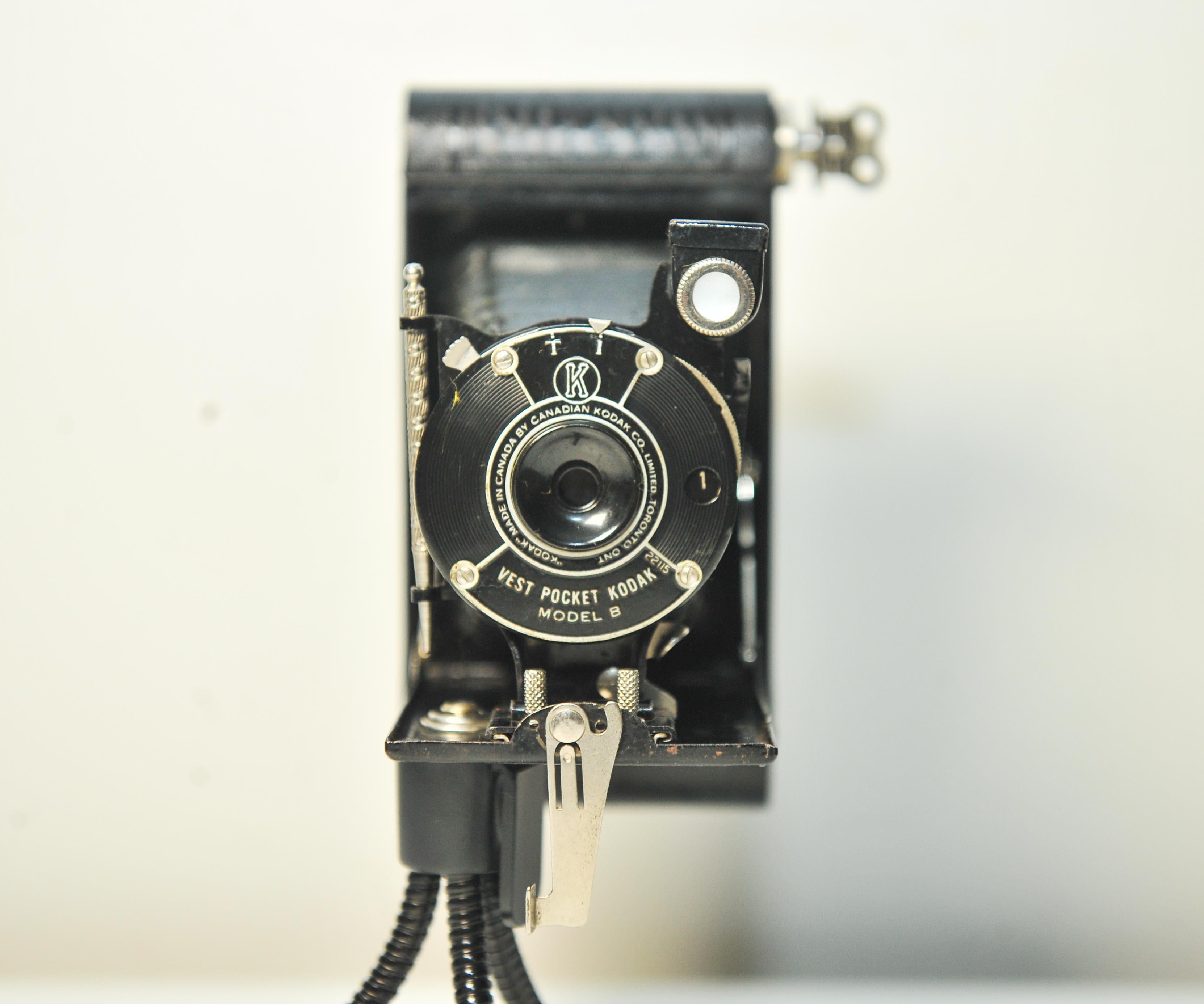 Art Deco Canadian Kodak Vest Pocket Kodak Model B 127 Film Folding Bellow Camera Made in Toronto, Ontario Canada 1925-34

Model ref 22115

This was a quite different camera; a primitive folding bed camera for making 4×6.5cm exposures on 127 film. It