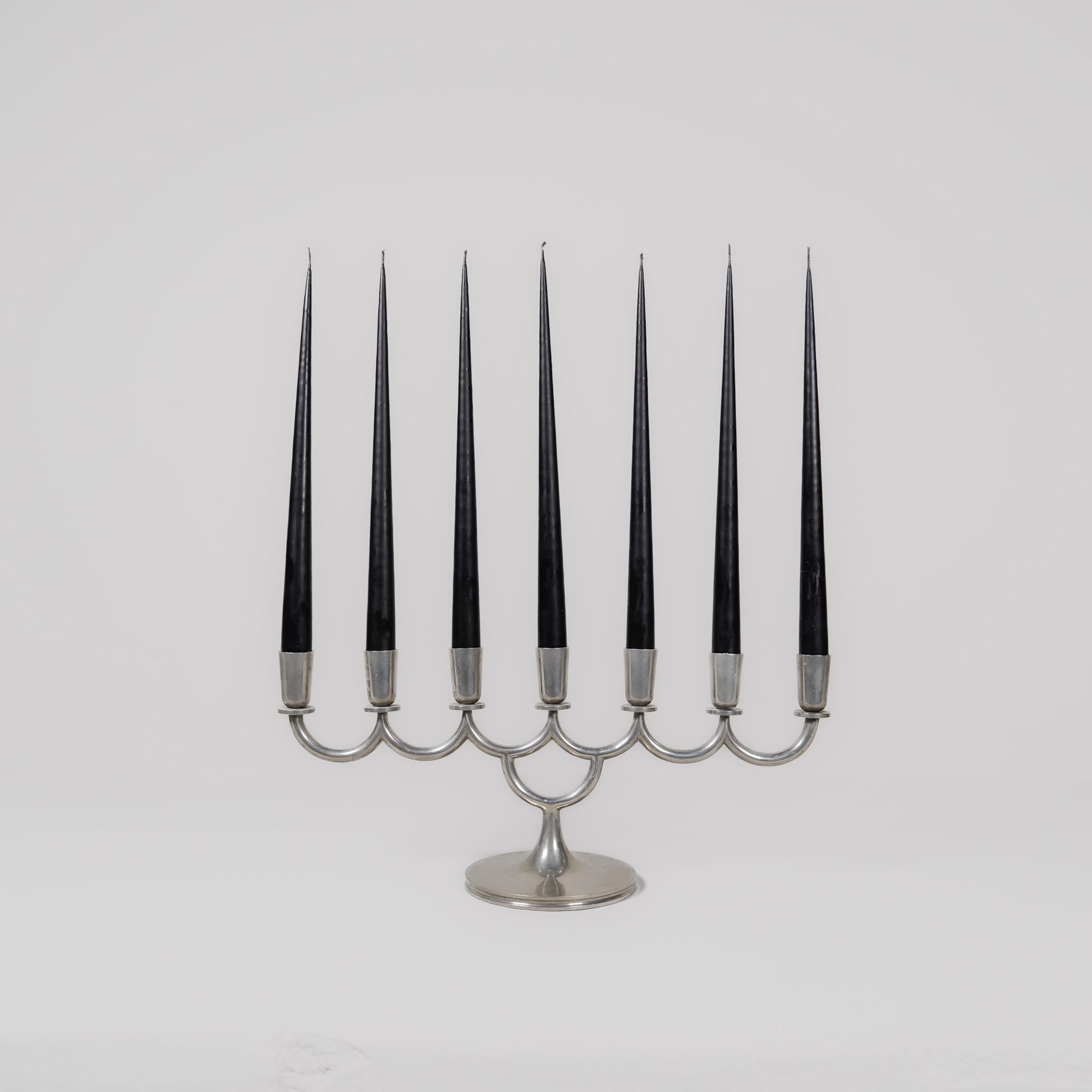 Art Deco candelabra designed by Lars Holmström. Produced by Lars Holmström in Arvika, Sweden 1931.
Wonderfully handcrafted pewter candelabra in art deco sculptured shapes. 

Signs of wear and use with a lovely patina. 

Dimensions: width 44 cm (17,3