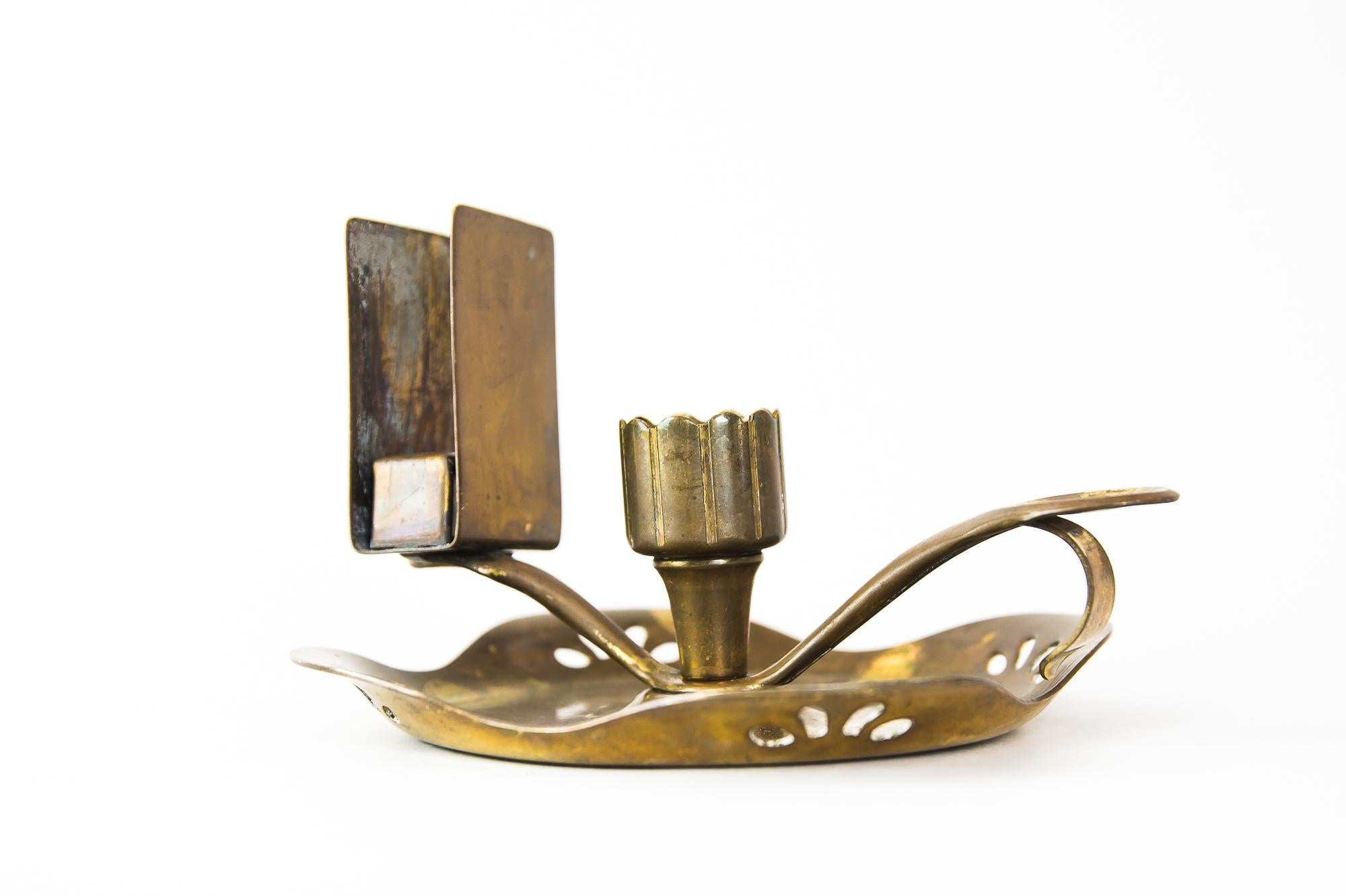 Art Deco candleholder with matchbox holder for wine cellars, Vienna, circa 1920s
Polished and stove enameled.