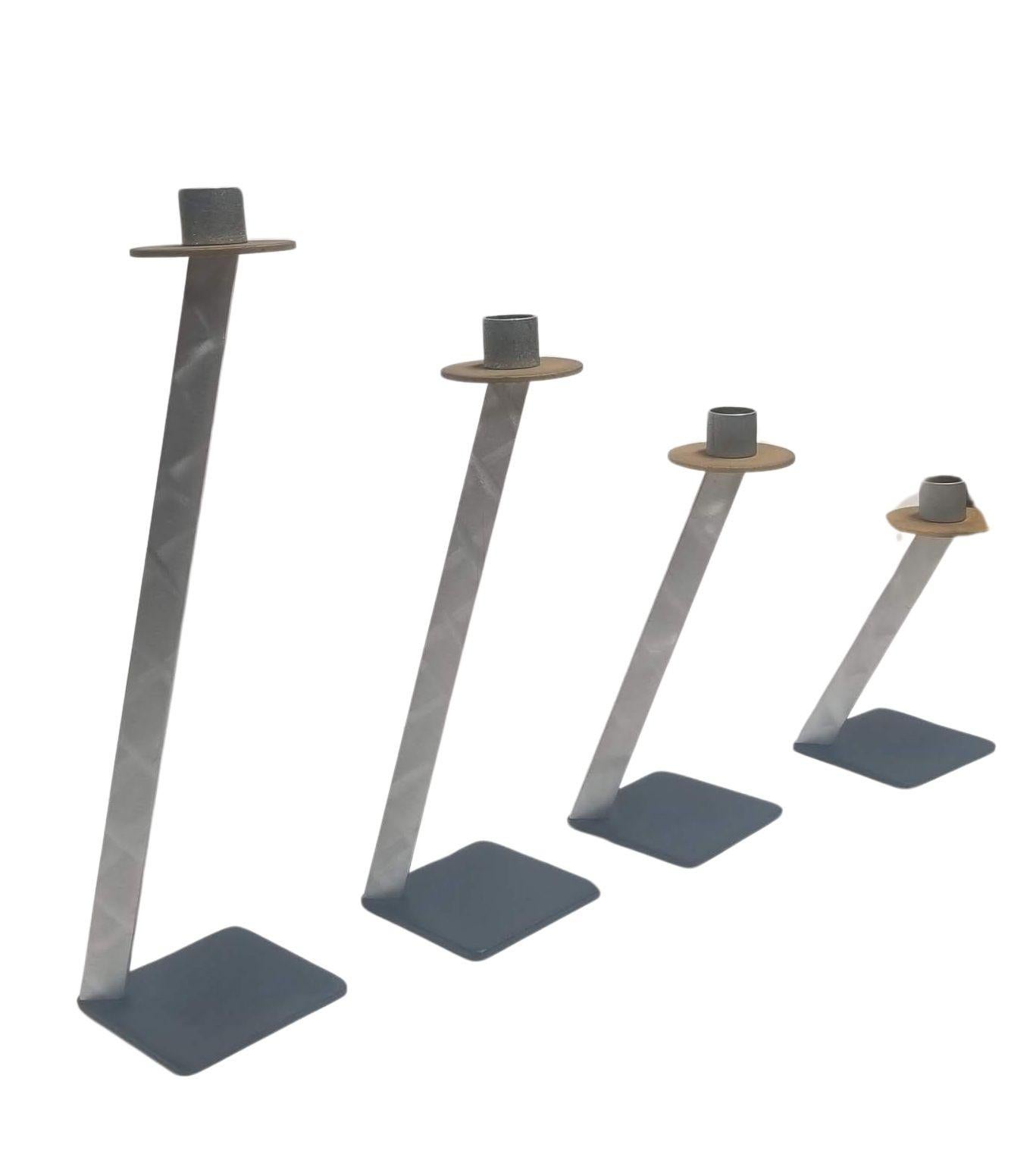 Elevate your home decor with the BRM Metal Candleholder Set of 4, personally curated by renowned designer Bruce MacDonald. This exquisite set includes four different sizes, offering a versatile and dynamic display to suit your styling preferences.