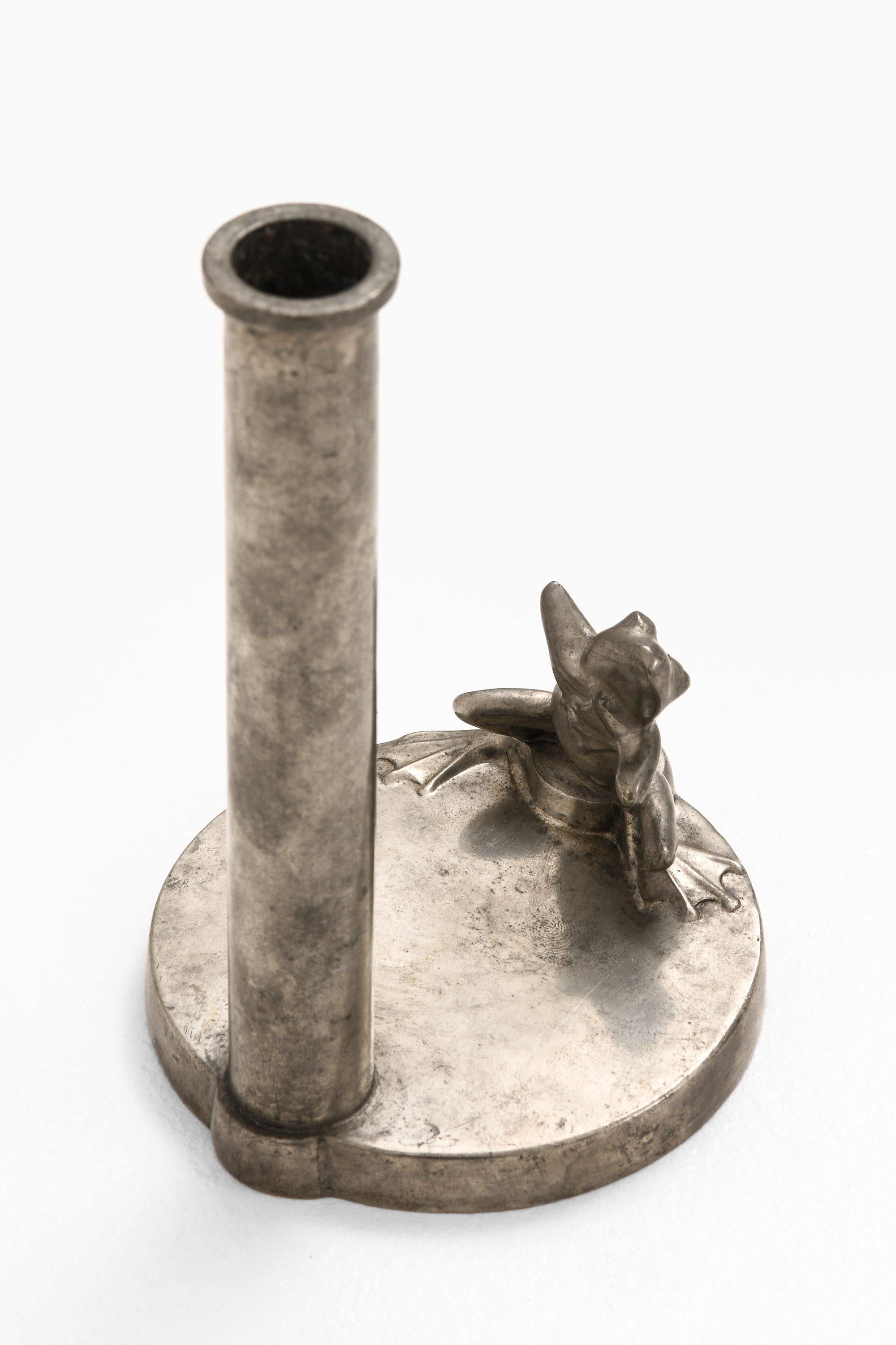 Art Deco Candlestick with Frog in Pewter, 1934

Additional Information:
Material: Pewter
Style: Mid century, Scandinavian
Produced by GAB in Sweden
Dimensions (W x D x H): 9.5 x 9.5 x 15.5 cm
Condition: Good vintage condition, with minor signs of